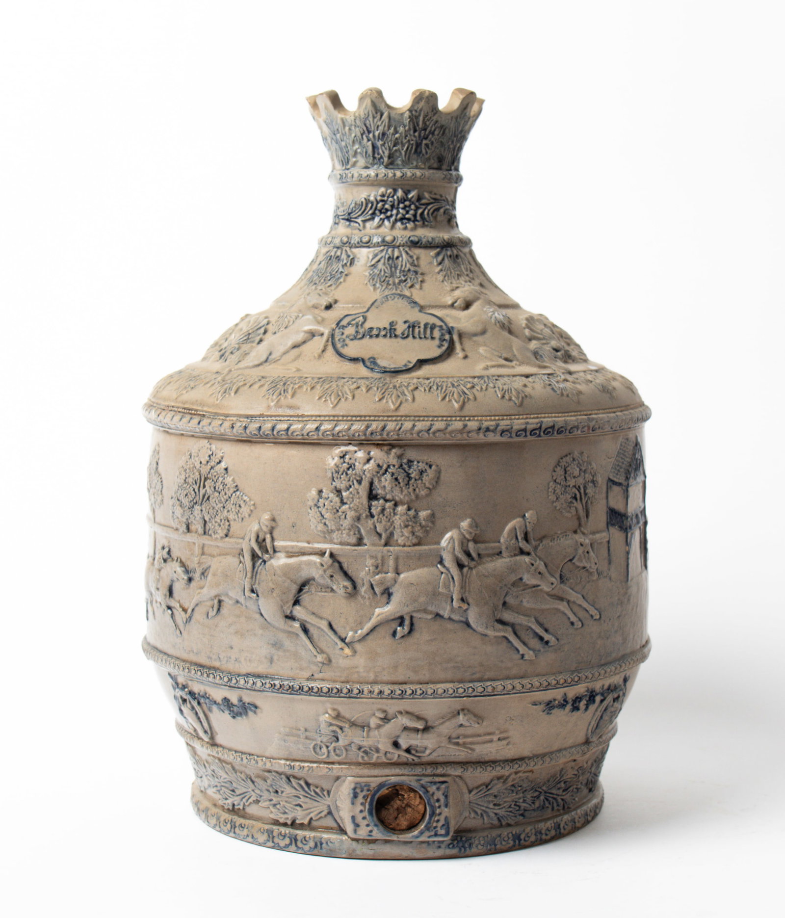 UNUSUAL "BROOK HILL" STONEWARE SOUR MASH WHISKEY DECANTER WITH RELIEF-MOLDED HORSE RACE SCENE: UNUSUAL "BROOK HILL" STONEWARE SOUR MASH WHISKEY DECANTER WITH RELIEF-MOLDED HORSE RACE SCENE ATTRIBUTED TO WHITE'S POTTERY (UTICA, NEW YORK). American, late 19th or early 20th Century. Bristol