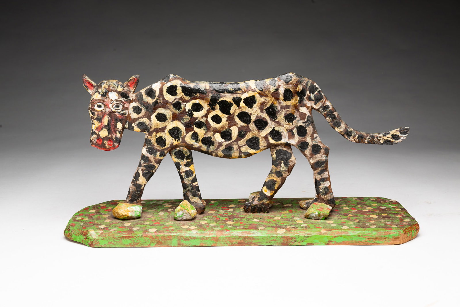ELIJAH PIERCE (OHIO, 1892 - 1984) CARVED AND PAINTED JAGUAR. (1 of 5)