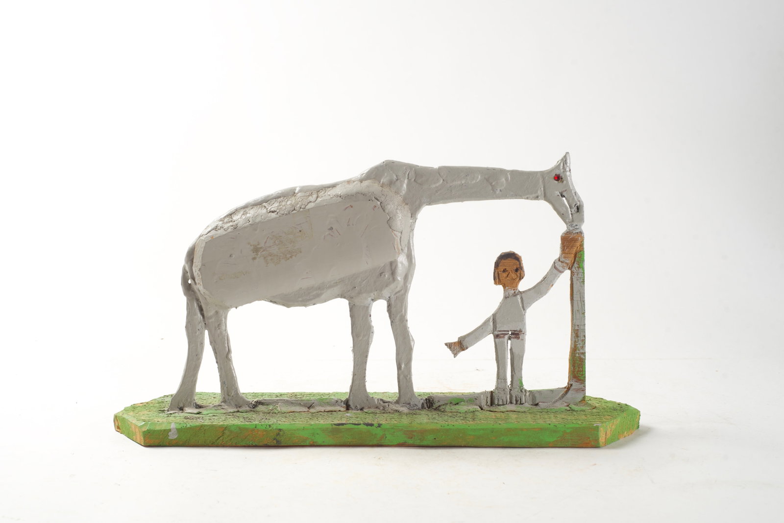 ELIJAH PIERCE (OHIO, 1892 - 1984) CARVED AND PAINTED WOOD SCULPTURE OF HORSE WITH BOY.: ELIJAH PIERCE (OHIO, 1892 - 1984) CARVED AND PAINTED WOOD SCULPTURE OF HORSE WITH BOY. American, 20th Century (dated 1979). Mixed media. Signed and dated to bottom. A boy standing with an outstretched