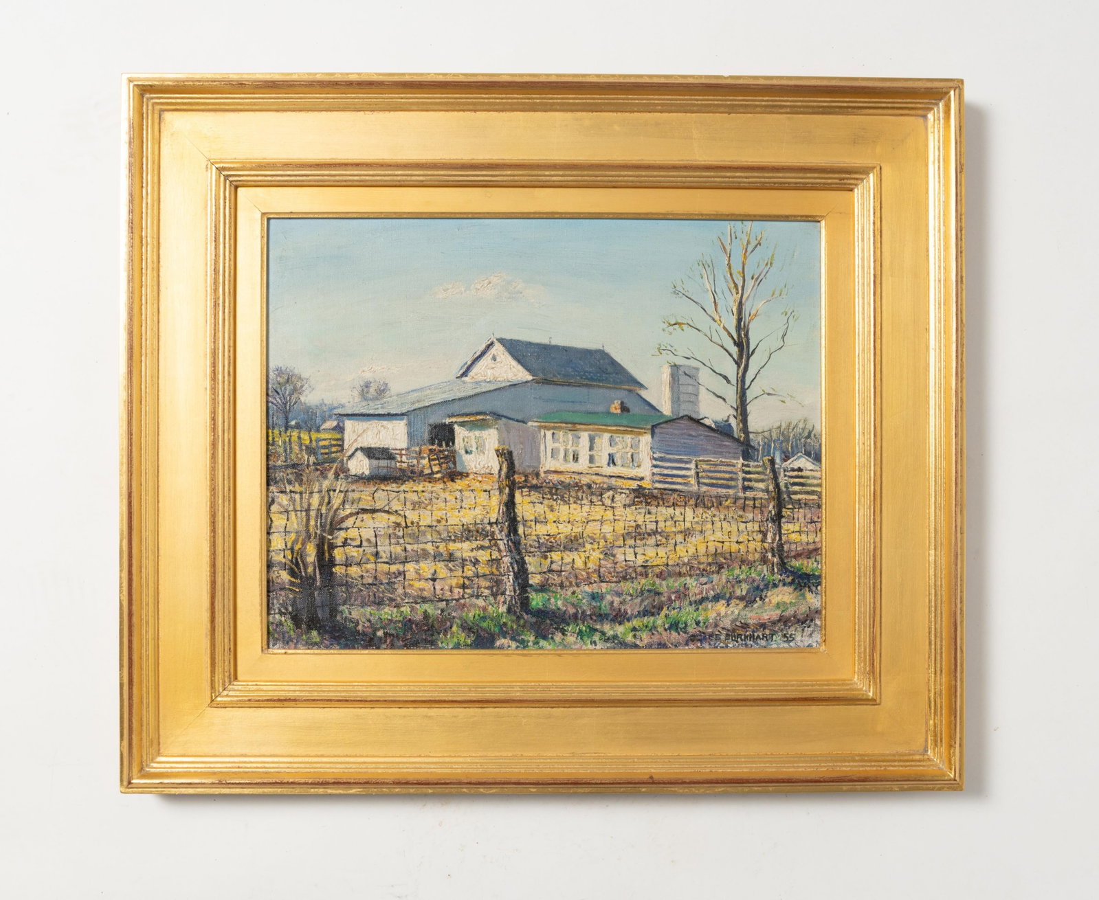 EMERSON BURKHART (OHIO, 1905 - 1969) OIL ON CANVAS OF A WHITE BARN, IN A HACKMAN FRAME.: EMERSON BURKHART (OHIO, 1905 - 1969) OIL ON CANVAS OF A WHITE BARN, IN A HACKMAN FRAME. American, 20th Century. A Late Summer scene of a large white barn with outbuildings and a silo with almost-bare 