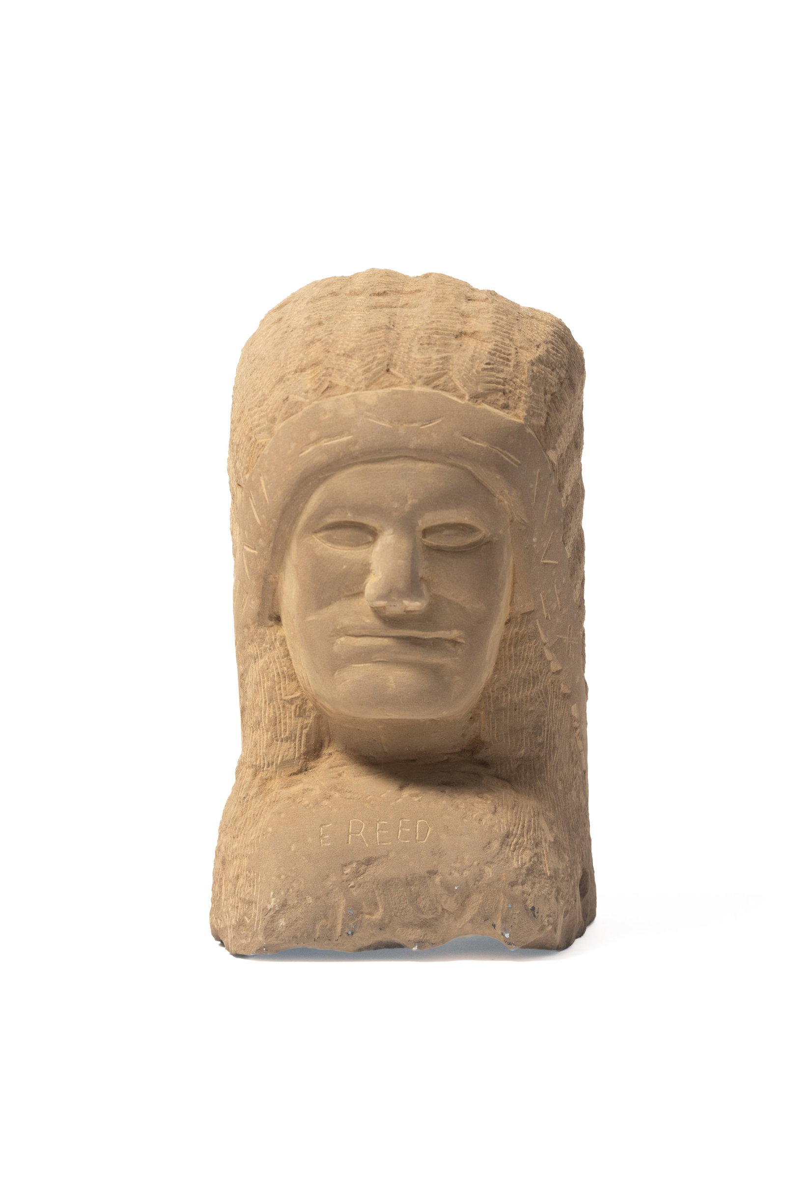ERNEST "POPEYE" REED (OHIO, 1919 - 1985) FOLK ART CARVED STONE NATIVE AMERICAN BUST SCULPTURE.: ERNEST "POPEYE" REED (OHIO, 1919 - 1985) FOLK ART CARVED STONE NATIVE AMERICAN BUST SCULPTURE. American, 20th Century. Signed to front. Bust depicting a Native American with long hair and wearing a fe