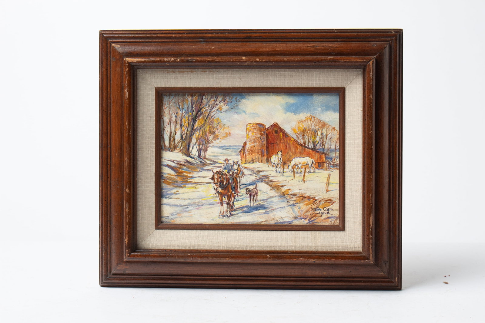LESLIE COPE (OHIO, 1913 - 2002) "THE TILE SILO, COOPERMILL RD. ZANESVILLE, OHIO" OIL ON BOARD.: LESLIE COPE (OHIO, 1913 - 2002) "THE TILE SILO, COOPERMILL RD. ZANESVILLE, OHIO" OIL ON BOARD. American (Mt. Hope, Ohio), Dated 1984. Depicting horses, a rider, and a dog traveling a road next to a re