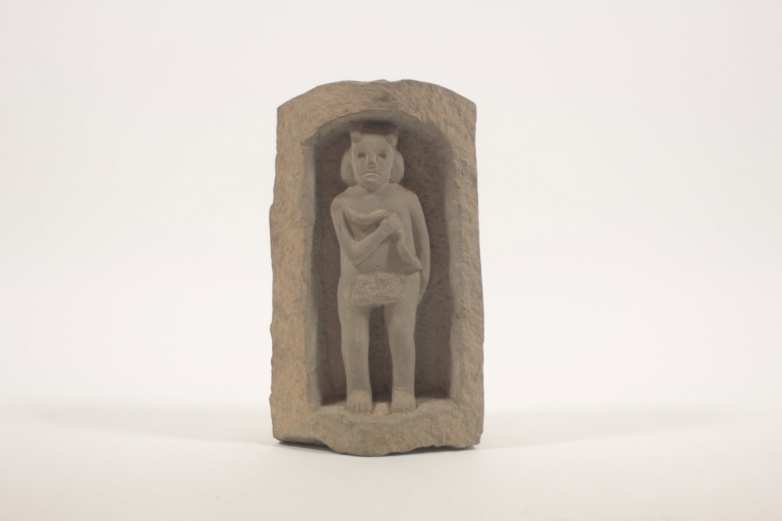ERNEST "POPEYE" REED (OHIO, 1919 - 1985) FOLK ART CARVED STONE FIGURE WITH SNAKE. (1 of 7)