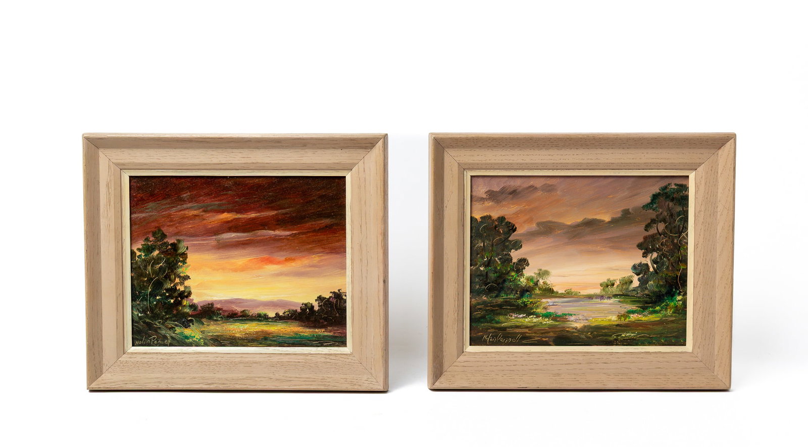TWO NOLAN PENNELL (OHIO, 1894 - 1972) OIL ON MASONITE LANDSCAPES.: TWO NOLAN PENNELL (OHIO, 1894 - 1972) OIL ON MASONITE LANDSCAPES. American, 20th Century. Oil on masonite. One depicting a landscape with a dark sky and a mountainous backdrop amid the trees, and the 