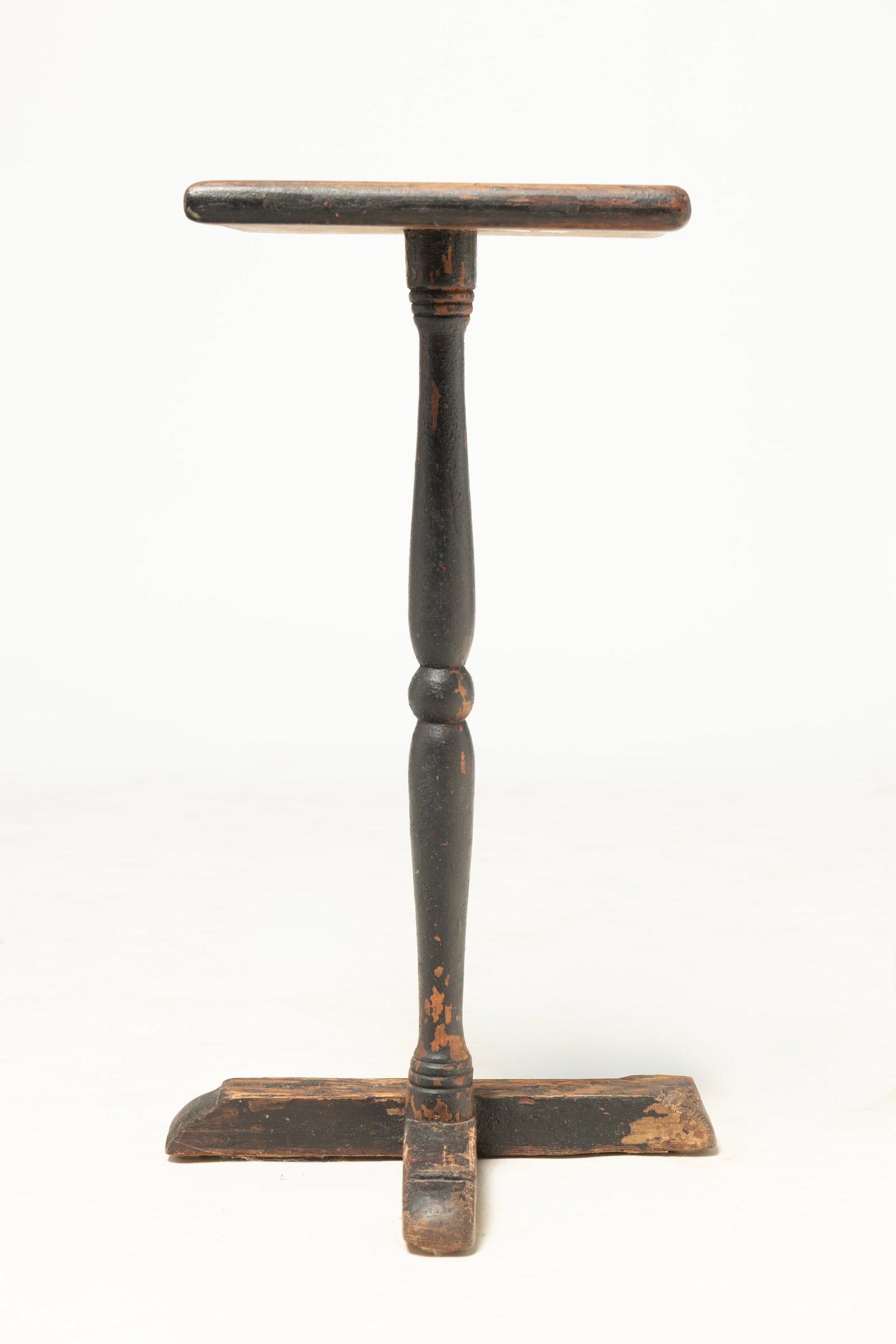 EARLY CANDLESTAND WITH "T" SHOEFOOT BASE ON ORIGINAL PAINT.: EARLY CANDLESTAND WITH "T" SHOEFOOT BASE ON ORIGINAL PAINT. American, mid- 18th Century. Oak and walnut. Top showing butterfly dovetails, turned center column with ball to middle, banded accents at