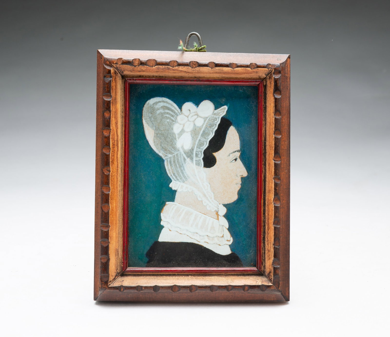 ATTRIBUTED TO RUTH HENSHAW MILES BASCOM (MASSACHUSETTS, 1772-1848) MINIATURE FOLK ART PORTRAIT.: ATTRIBUTED TO RUTH HENSHAW MILES BASCOM (MASSACHUSETTS, 1772-1848) MINIATURE FOLK ART PORTRAIT. American, 19th Century. Gouache, pastel, and ink on paper. Profile portrait of a woman facing right, her