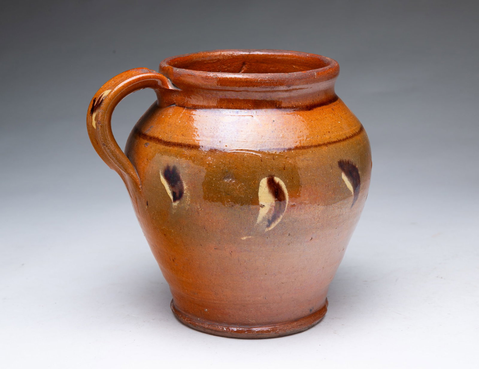 POLYCHROME GLAZED REDWARE JAR WITH HANDLE. - 2