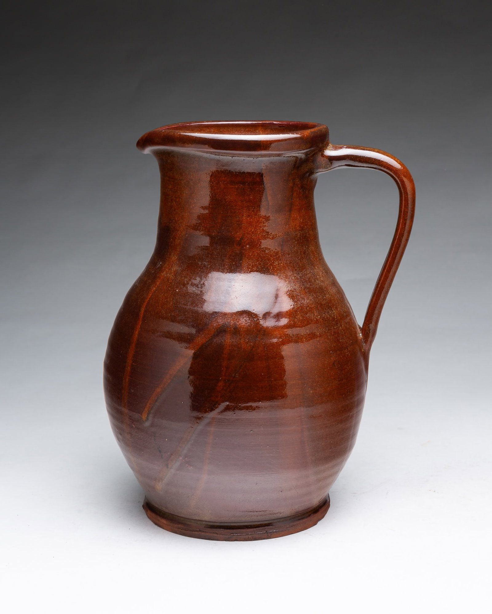 LARGE NEW ENGLAND ALBANY SLIP GLAZED REDWARE PITCHER. (1 of 5)
