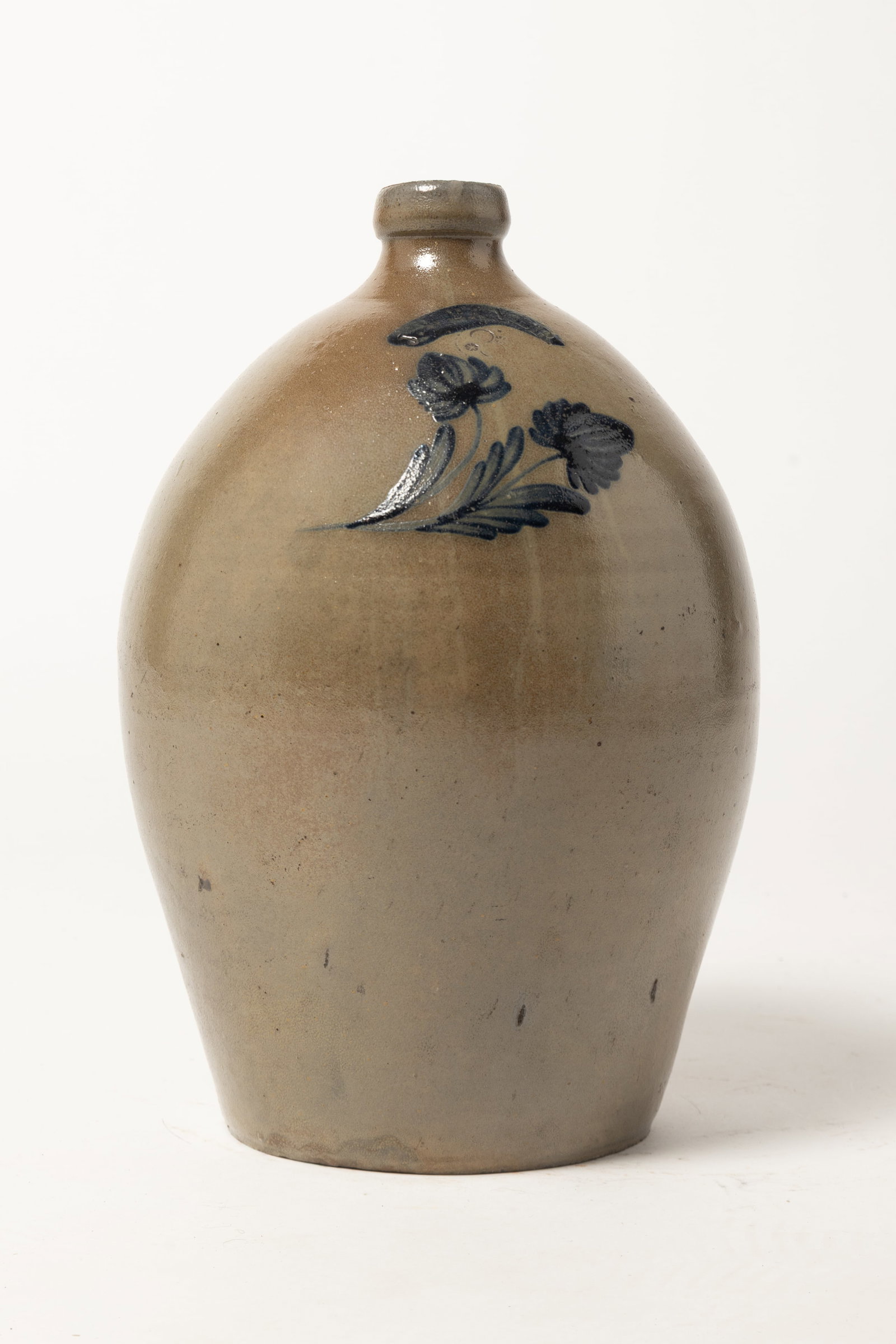 STONEWARE JUG WITH BRUSHED COBALT DECORATION MARKED J. WEAVER (BEAVER, PENNSYLVANIA).: STONEWARE JUG WITH BRUSHED COBALT DECORATION MARKED J. WEAVER (BEAVER, PENNSYLVANIA). American (Southwestern Pennsylvania), 19th Century. Ovoid jug with large, semi-rounded rim and applied strap handl