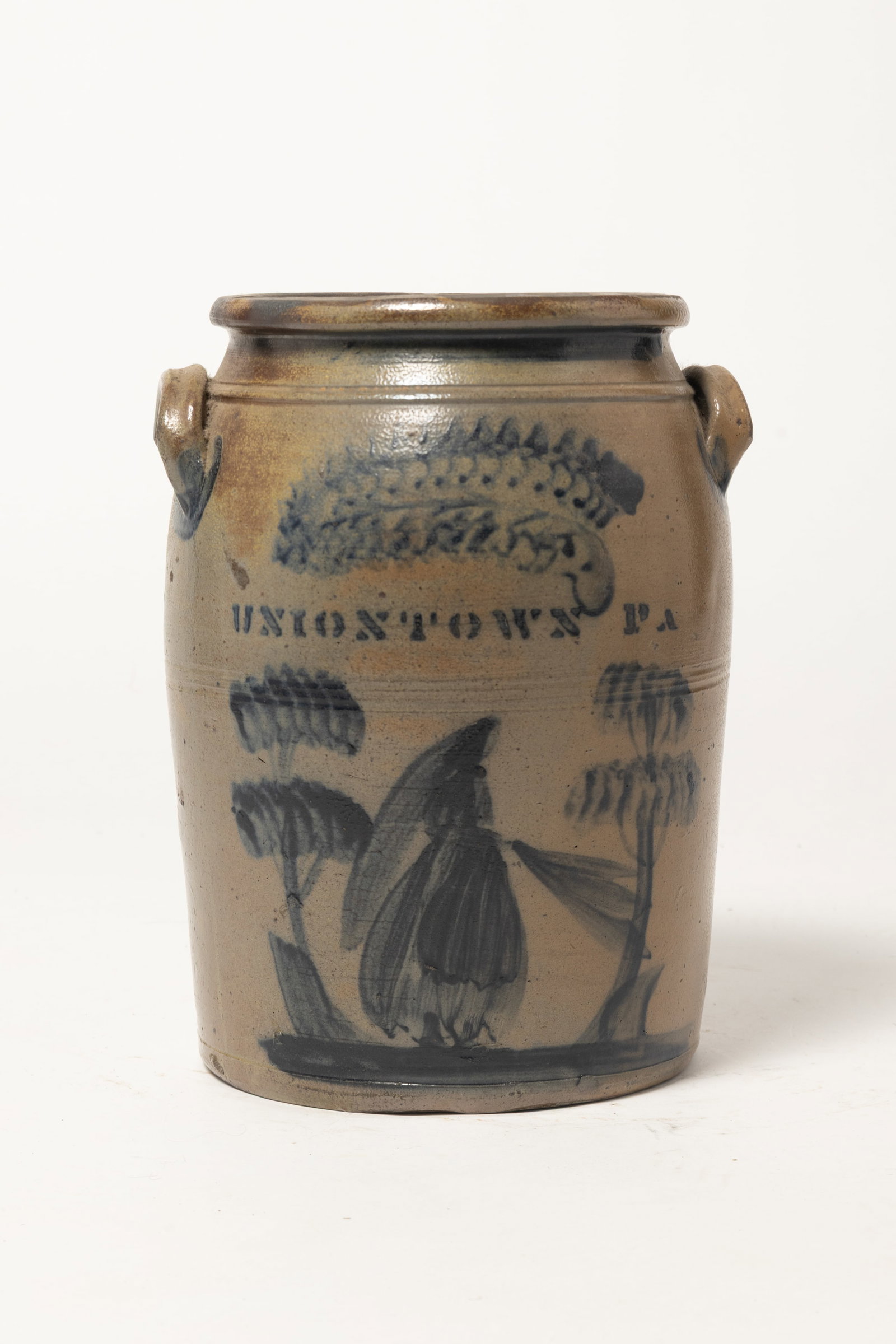 SCARCE AND IMPORTANT MARKED UNIONTOWN, PENNSYLVANIA FREEHAND COBALT DECORATED STONEWARE "PEOPLE" JAR: SCARCE AND IMPORTANT MARKED UNIONTOWN, PENNSYLVANIA FREEHAND COBALT DECORATED STONEWARE "PEOPLE" JAR WITH LADY WERING A VEIL AND HOLDING A PARASOL ATTRIBUTED TO NORVAL GREENLAND (ACTIVE 1870 - 1882). 