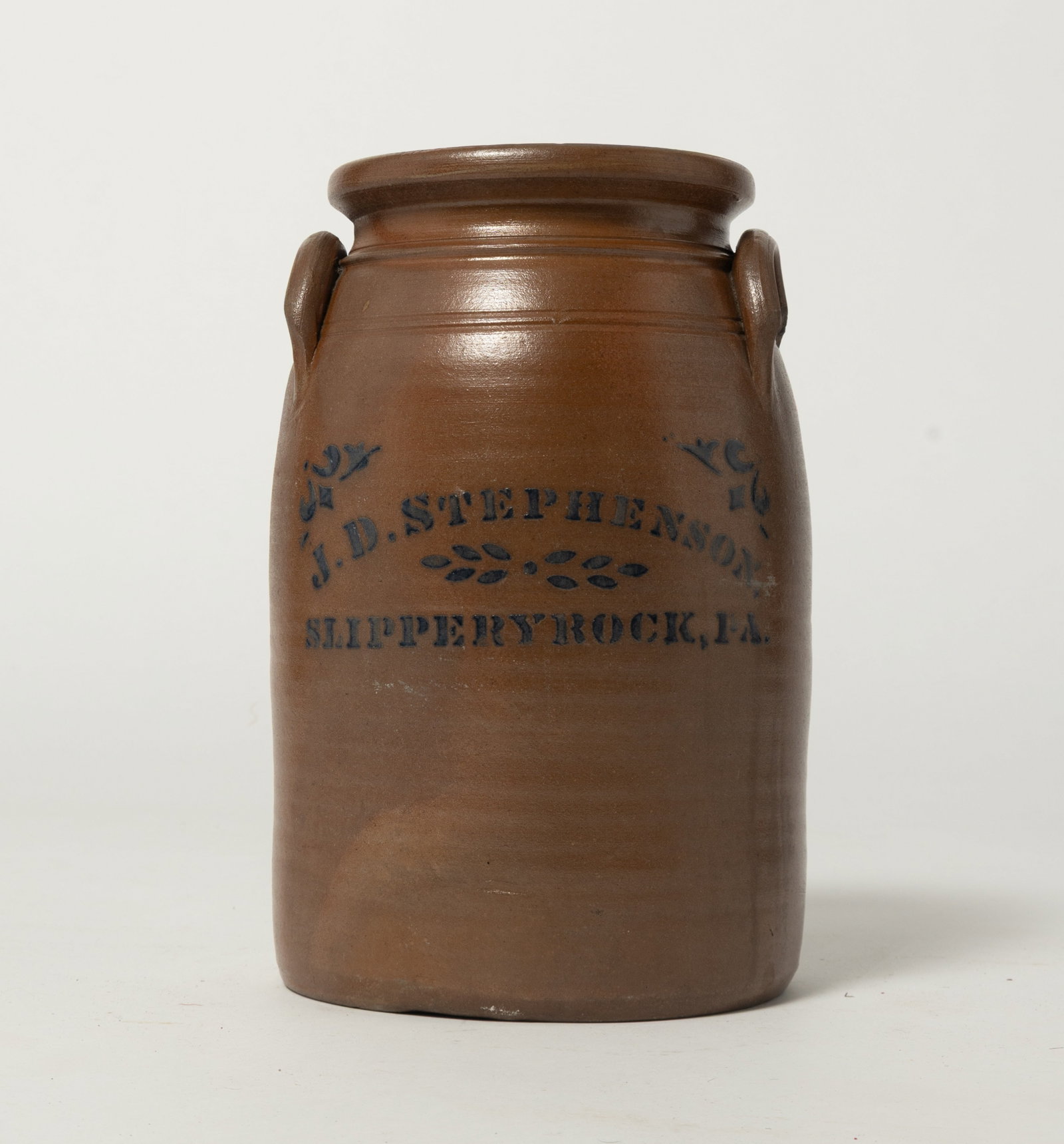 SCARCE MARKED J.D. STEPHENSON (SLIPPERY ROCK, PENNSYLVANIA) STONEWARE JAR WITH UNUSUAL GLAZE.: SCARCE MARKED J.D. STEPHENSON (SLIPPERY ROCK, PENNSYLVANIA) STONEWARE JAR WITH UNUSUAL GLAZE. American (Southwestern Pennsylvania), 19th Century. Of slight barrel form with proud. high shoulder, semi-