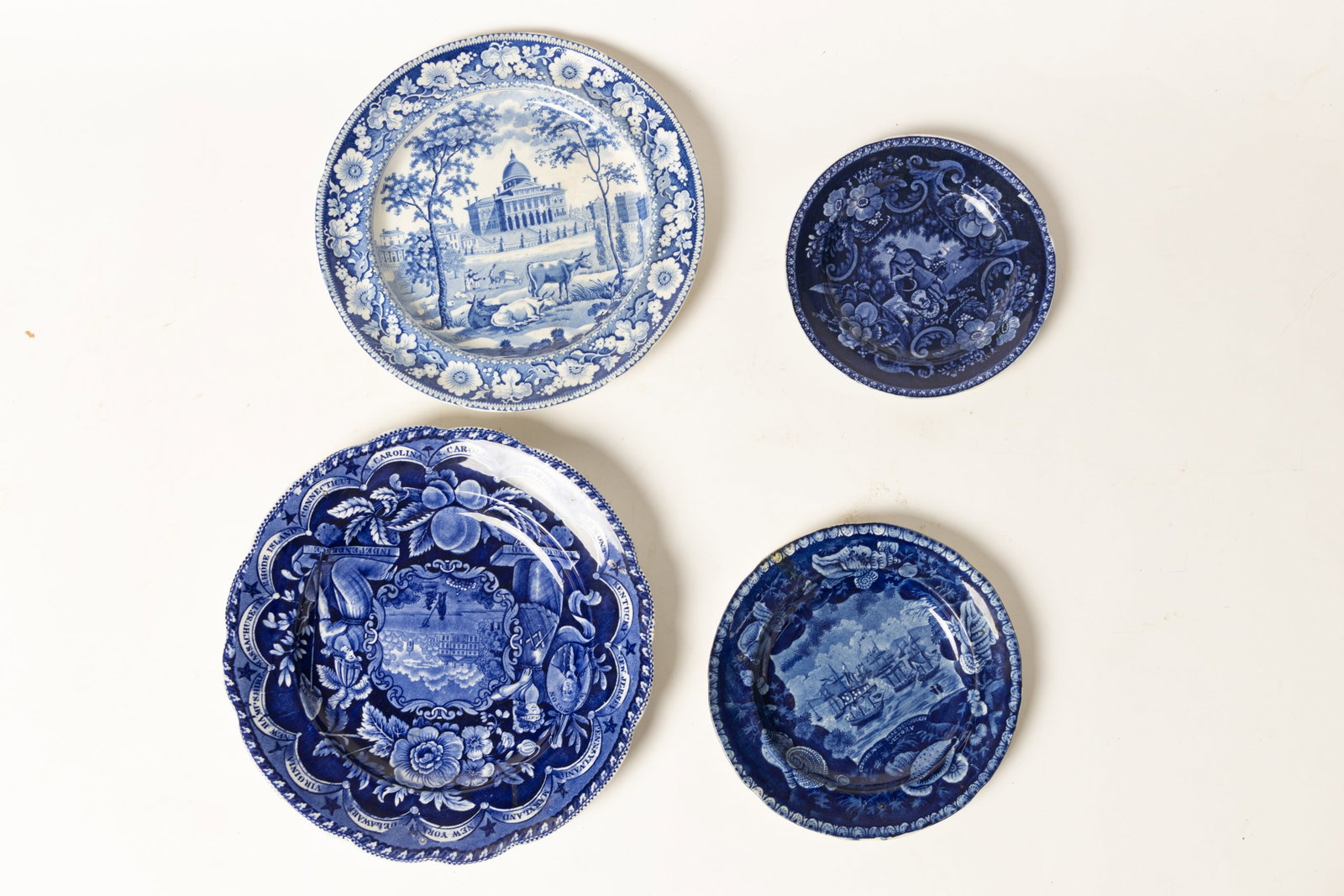 FOUR STAFFORDSHIRE HISTORICAL BLUE AMERICAN SCENE PLATES. (1 of 1)