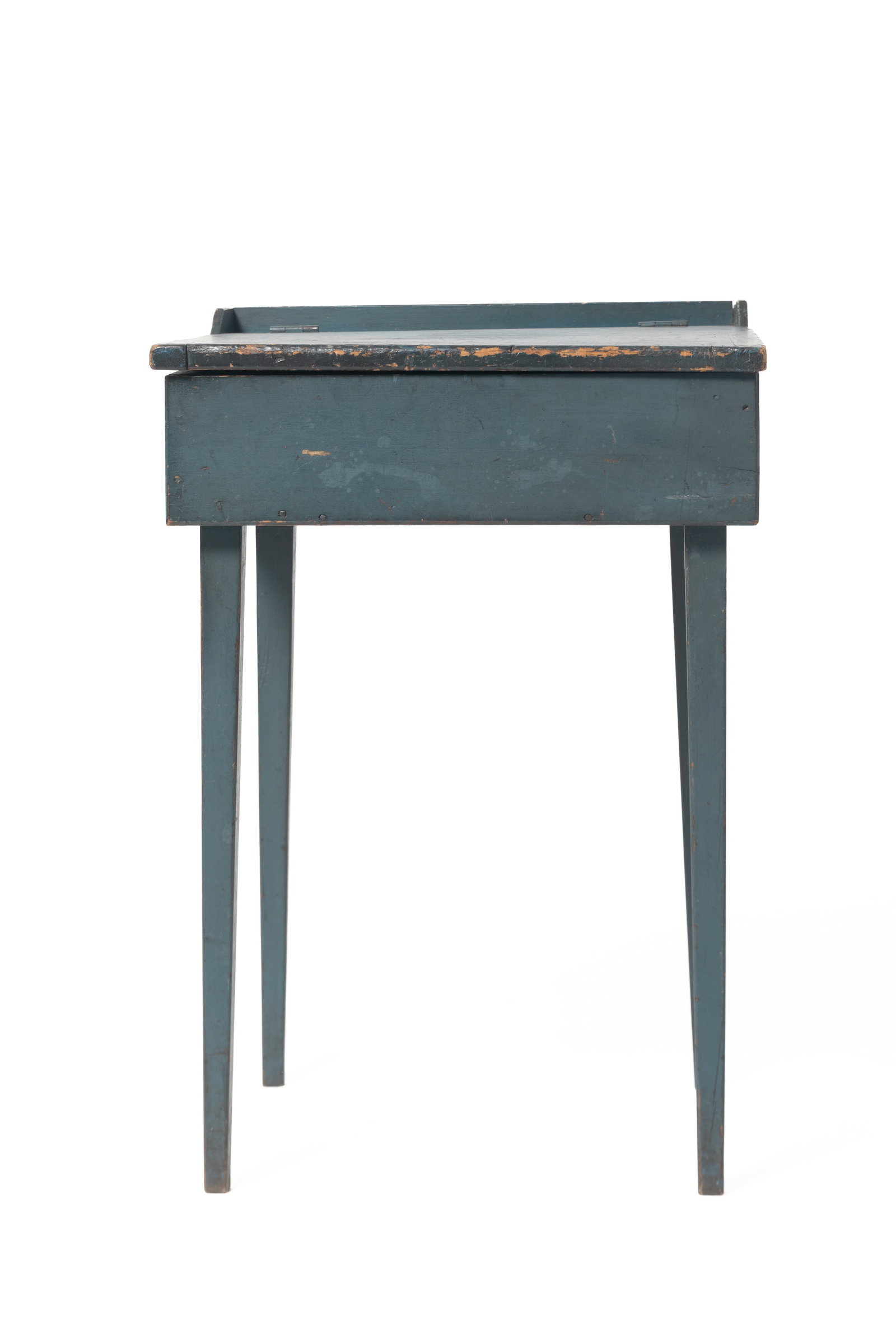 DIMINUTIVE NEW ENGLAND HEPPLEWHITE CHILD'S LIFT-TOP DESK IN ORIGINAL BLUE PAINT.: DIMINUTIVE NEW ENGLAND HEPPLEWHITE CHILD'S LIFT-TOP DESK IN ORIGINAL BLUE PAINT. American, 19th Century. Poplar and pine. Having a slightly-raised, three-quarter gallery continuing to a hinged top wit