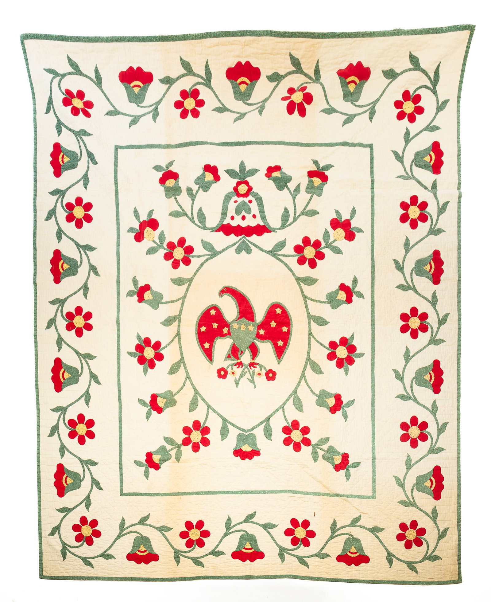 EARLY PATRIOTIC APPLIQUE QUILT WITH AMERICAN EAGLE CENTER MEDALLION ATTRIBUTED TO PENNSYLVANIA.: EARLY PATRIOTIC APPLIQUE QUILT WITH AMERICAN EAGLE CENTER MEDALLION ATTRIBUTED TO PENNSYLVANIA. American, mid- 19th Century. Cotton. Hand-stitched in patterned and solid color fabrics. Vining floral b