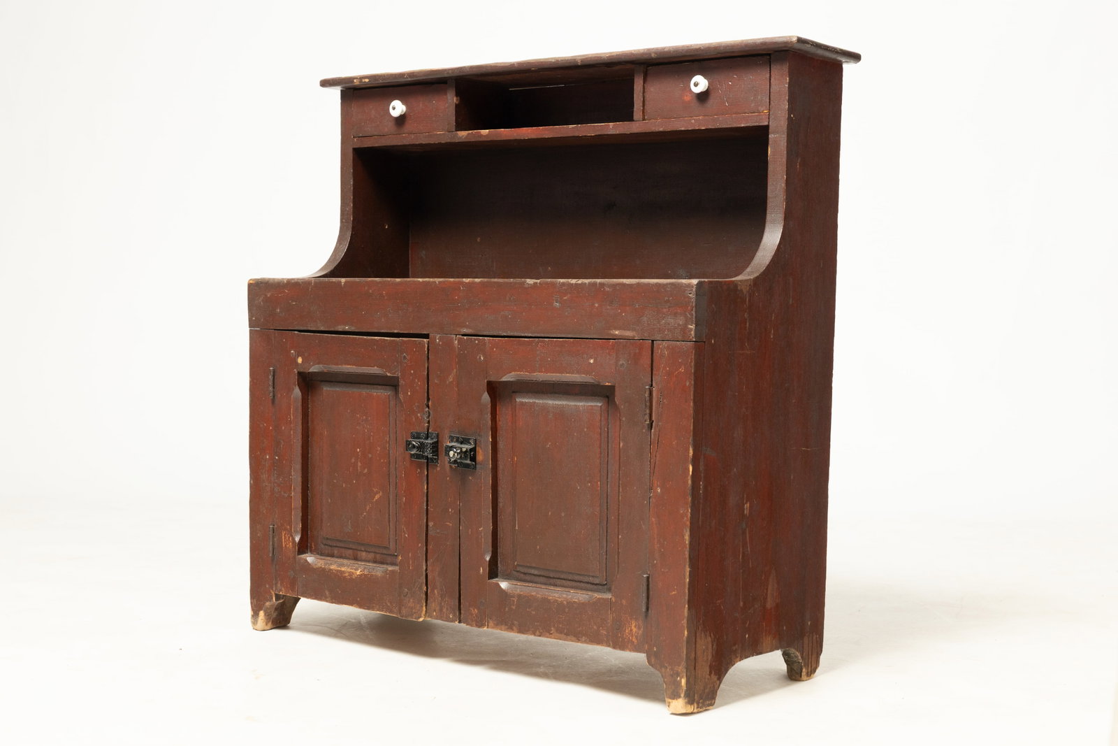 DIMINUTIVE CHILD'S HIGH-BACK DRY SINK.: DIMINUTIVE CHILD'S HIGH-BACK DRY SINK. American, 19th or 20th Century. Back with shelf holding two drawers with porcelain knobs, a deep well, half-round cut-out ends, double-raised panel doors, and a