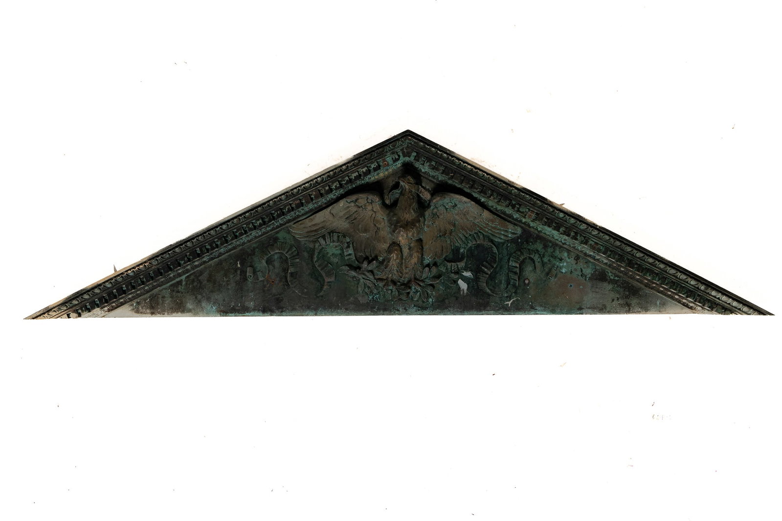 NEW YORK BRONZE ARCHITECTURAL LINTEL WITH EAGLE.: NEW YORK BRONZE ARCHITECTURAL LINTEL WITH EAGLE. American (New York State), late 19th Century. Triangular pediment with egg course over a dentil course, spread-winged eagle with ribbon banner in his