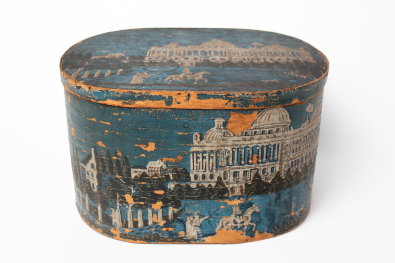 SCARCE WALLPAPER BAND BOX WITH IMAGES OF THE WHITE HOUSE.: SCARCE WALLPAPER BAND BOX WITH IMAGES OF THE WHITE HOUSE. American, second quarter 19th Century. Papered in block printed bright blue paper with an early image of the White House and grounds. 18"l.