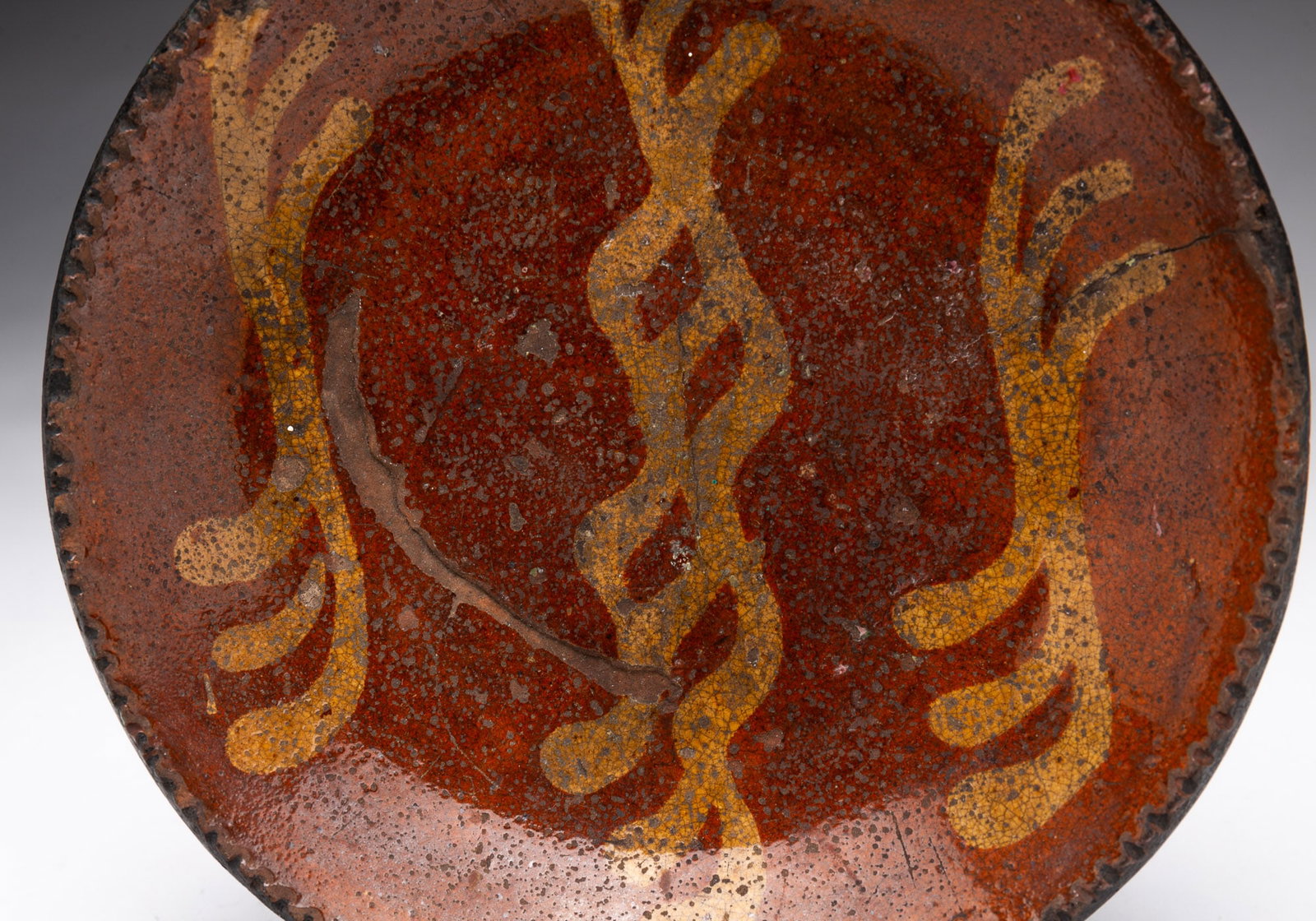 SLIP-DECORATED REDWARE PLATE. - 2