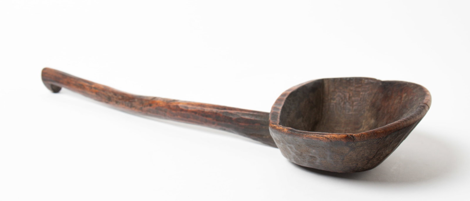 CARVED WOOD LADLE.: CARVED WOOD LADLE. American, 19th Century. With large bowl and notched handle; 6.5"w. 12"l. Provenance: Nancy Goff (Alliance, Ohio).
