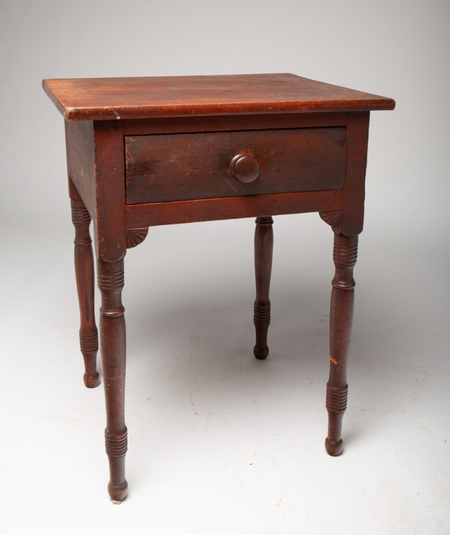 SHERATON ONE-DRAWER STAND WITH FAN CARVINGS IN ORIGINAL RED PAINT.: SHERATON ONE-DRAWER STAND WITH FAN CARVINGS IN ORIGINAL RED PAINT. American, 19th Century. Cherry. Having a rectangular top above a single, dovetailed drawer and rising on ring-turned legs with