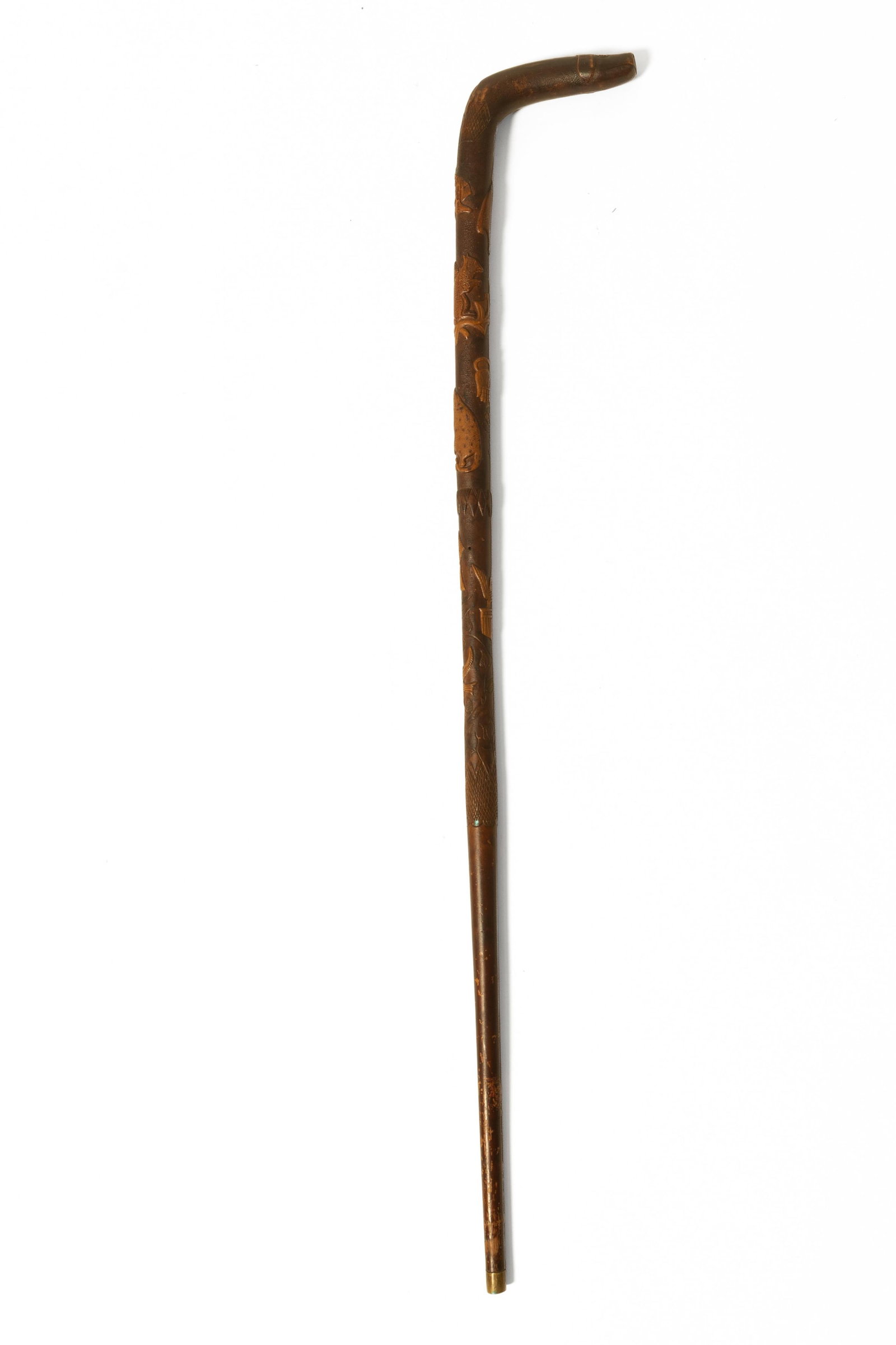 FOLK ART CARVED WOODEN CANE WITH PATRIOTIC SYMBOLS, ANIMALS, AND HEARTS.: FOLK ART CARVED WOODEN CANE WITH PATRIOTIC SYMBOLS, ANIMALS, AND HEARTS. American, Late 19th or Early 20th Century. Curved handle carved with a dog face, shaft carved with a heart, raccoon, squirrel, 
