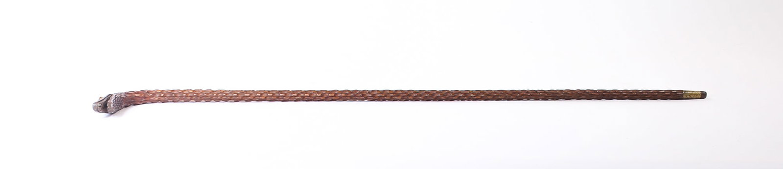 FOLK ART CARVED WOODEN CANE WITH ALLIGATOR HANDLE.: FOLK ART CARVED WOODEN CANE WITH ALLIGATOR HANDLE. American, Late 19th or Early 20th Century. Handle carved as an alligator with carved scales bearing sharp teeth, with inset glass eyes, the shaft