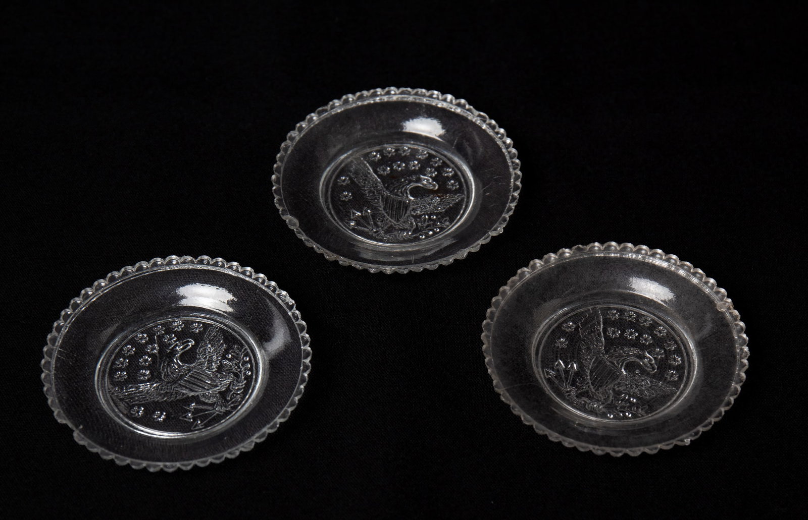 FIVE PRESSED FLINT GLASS EAGLE CUP PLATES. - 5
