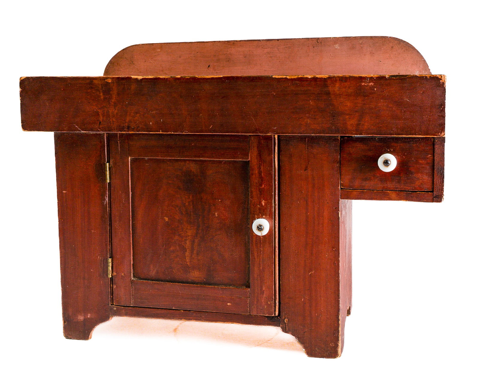 BERKS COUNTY, PENNSYLVANIA, DOLL SIZE GRAIN PAINTED DRY SINK.: BERKS COUNTY, PENNSYLVANIA, DOLL SIZE GRAIN PAINTED DRY SINK. American, mid- 19th Century. Pine. Backsplash with rounded corners, lower single panel door with beaded edge, candle drawer at right,