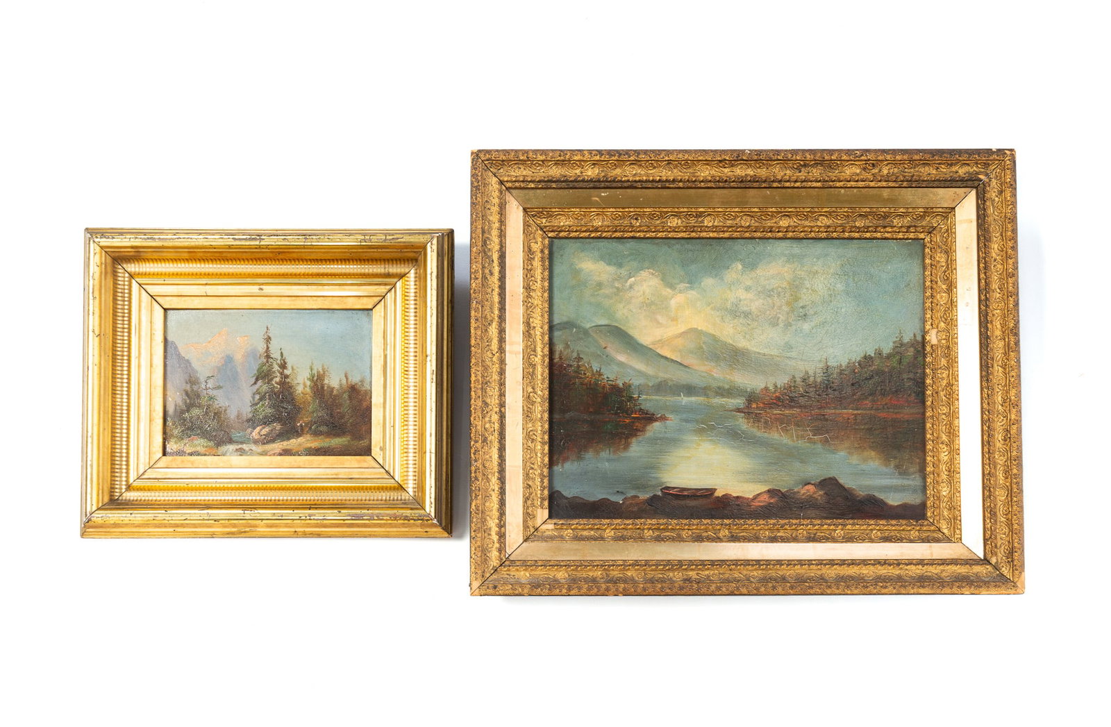 TWO OIL ON BOARD LANDSCAPES IN GILT FRAMES.: TWO OIL ON BOARD LANDSCAPES IN GILT FRAMES. American, 19th Century. Unsigned. The larger shows a shoreside landscape filled with trees, a mountainous background, under a cloudy blue sky. Sight, 9.25"h