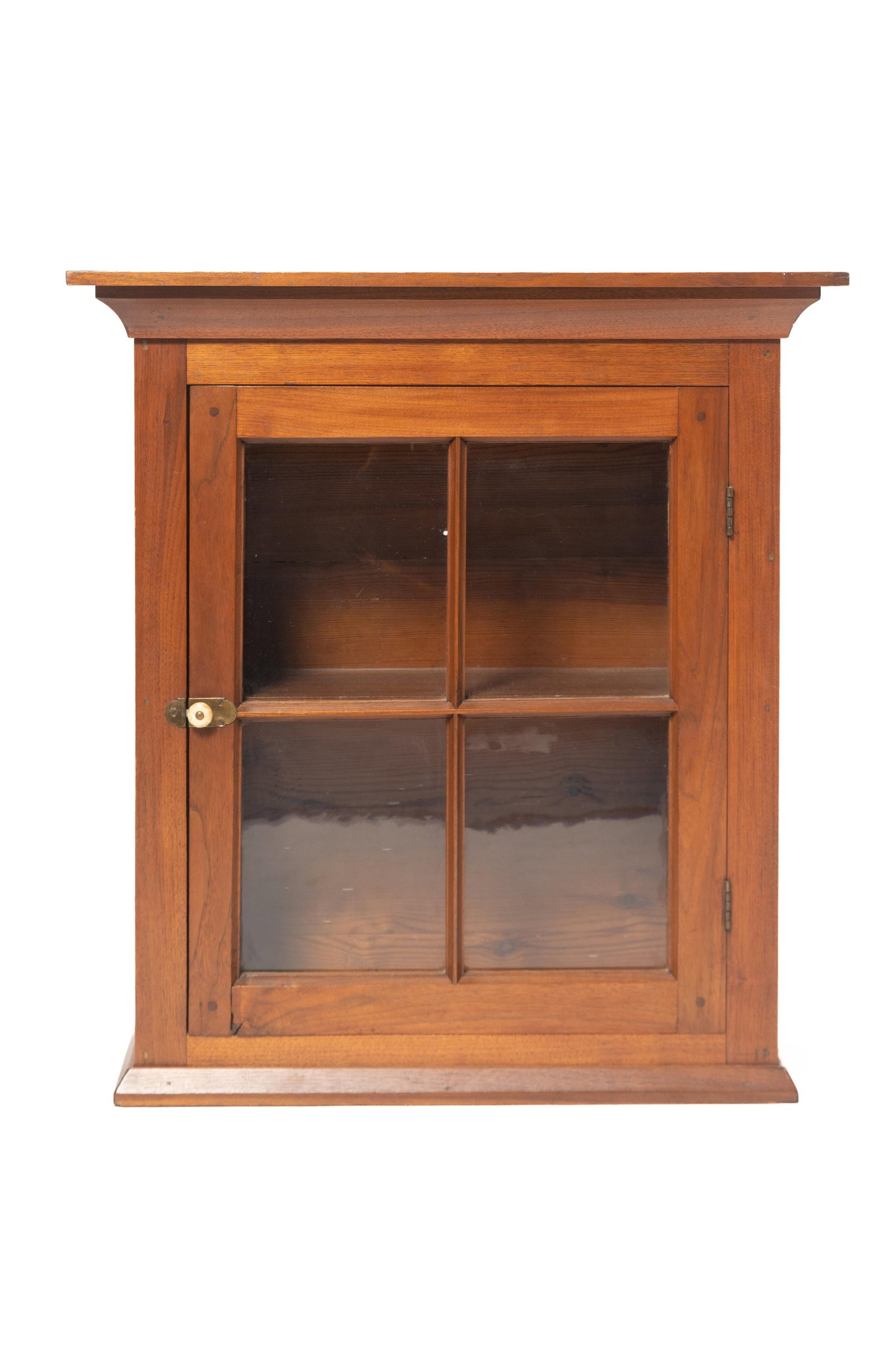 OAK HANGING CUPBOARD WITH GLASS DOORS.: OAK HANGING CUPBOARD WITH GLASS DOORS. American, 19th Century. Pine secondary. Cornice top over bridle-joint case with pegged construction, four-paned door with old glass opening to a single shelf int