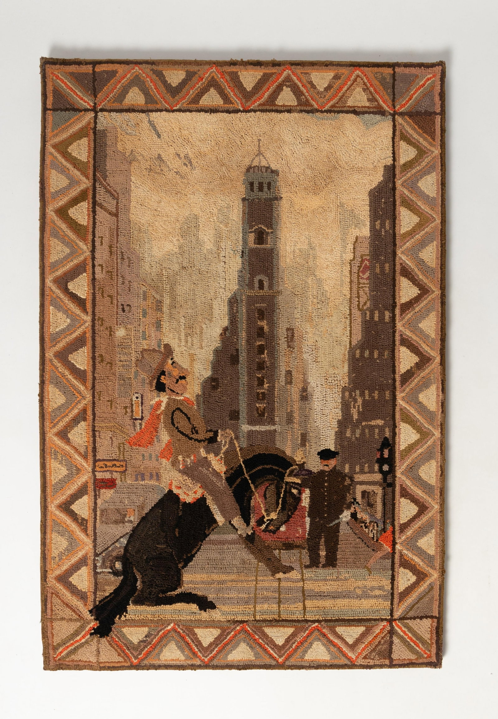 UNUSUAL LARGE MOUNTED PICTORIAL CITY SCENE HOOKED RUG WITH HORSE AND RIDER.: UNUSUAL LARGE MOUNTED PICTORIAL CITY SCENE HOOKED RUG WITH HORSE AND RIDER. American, early 20th Century. Depicting a horse with rider on a city street; with a geometric border. Mounted, 49"h. 32.5"w.