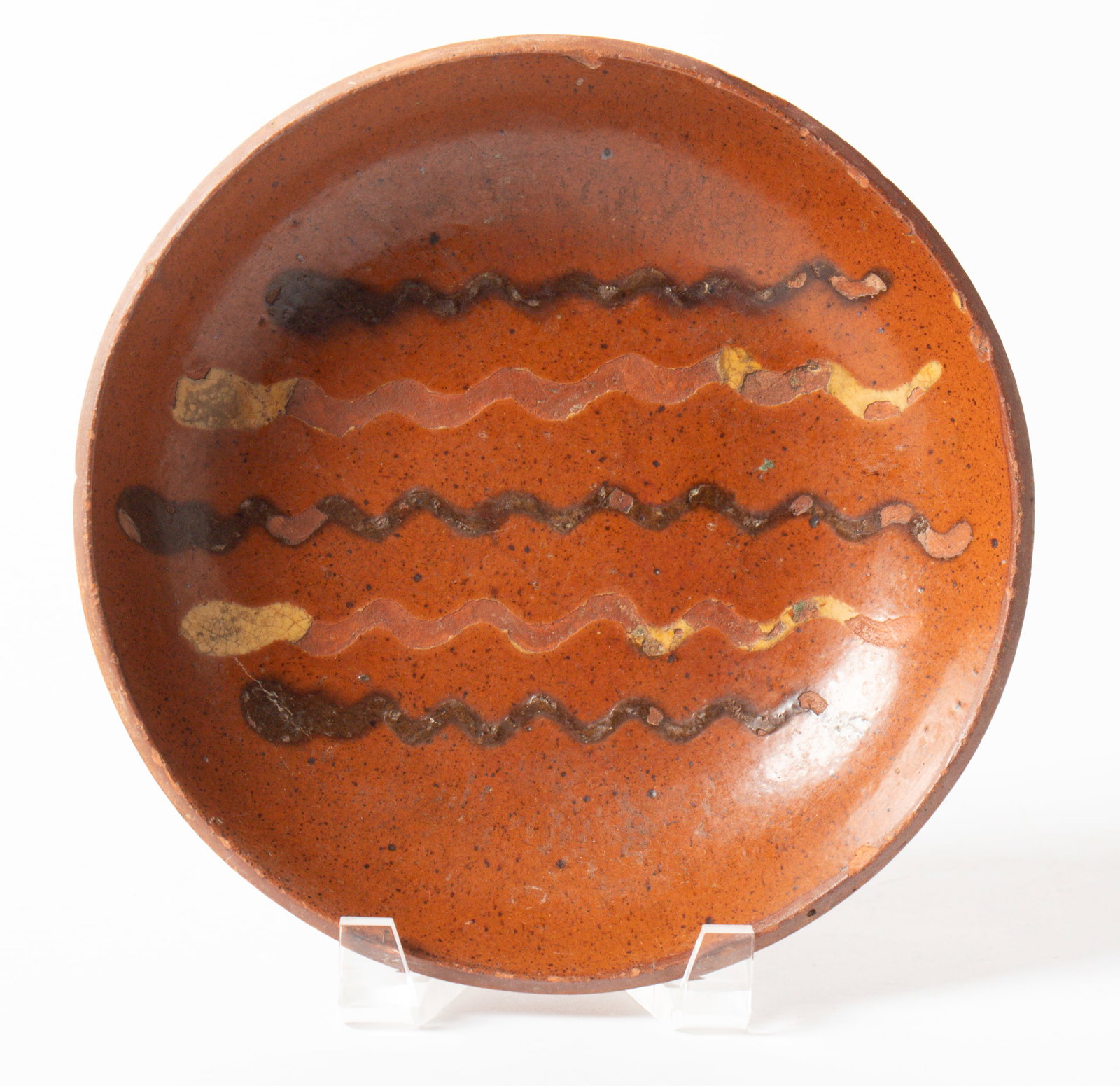 WILLOUGHBY SMITH (WOMELSDORF, PENNSYLVANIA, 1839-1904) SLIP-DECORATED REDWARE SHALLOW BOWL. (1 of 3)