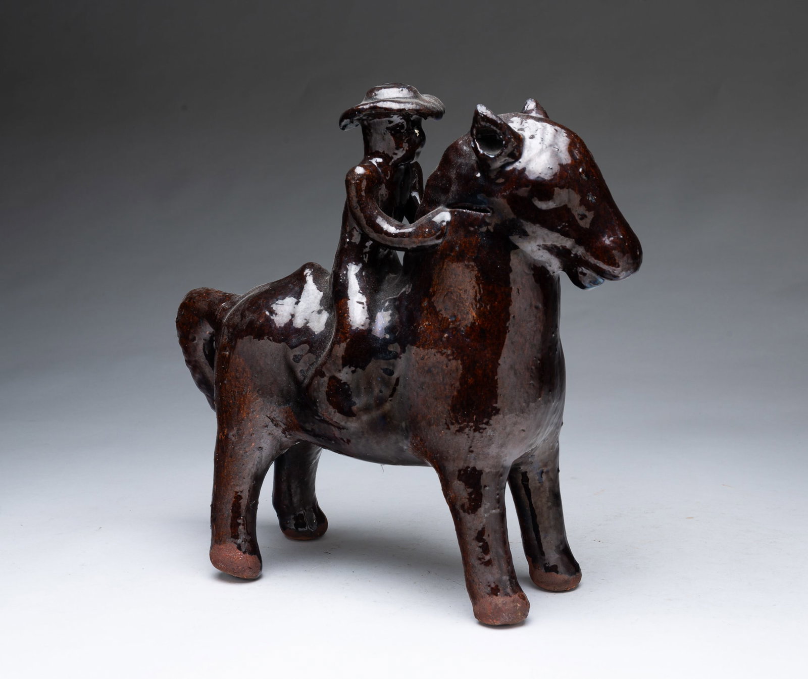GLAZED REDWARE HORSE AND RIDER. (1 of 4)