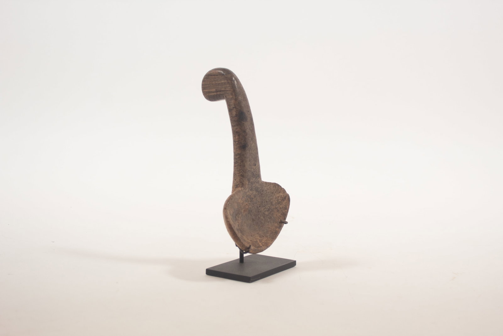 EASTERN GREAT LAKES WOODLANDS ASH BURL LADLE.: EASTERN GREAT LAKES WOODLANDS ASH BURL LADLE. Native American, mid- 18th Century or earlier. Disc terminal. On a modern stand. 8"l. 5"w. Provenance: Steve Powers; Peter Brams; Steve Powers; Private