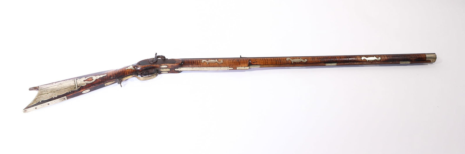 NATHAN JARVIS (BELMONT COUNTY, OHIO) FULL STOCK RIFLE WITH SILVER INLAYS.: NATHAN JARVIS (BELMONT COUNTY, OHIO) FULL STOCK RIFLE WITH SILVER INLAYS. American, First half 19th Century. Tiger maple stock, approximately 32 caliber, octagonal barrel, signed in script on top