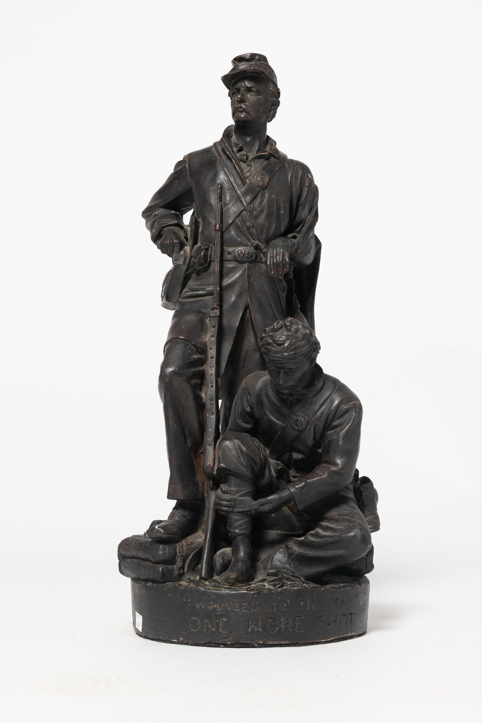 JOHN ROGERS "WOUNDED TO THE REAR, ONE MORE SHOT!": JOHN ROGERS "WOUNDED TO THE REAR, ONE MORE SHOT!" American, Second half 19th Century. Civil War Union Soldiers, one standing in full uniform with rifle and foot on knapsack, and one kneeling with