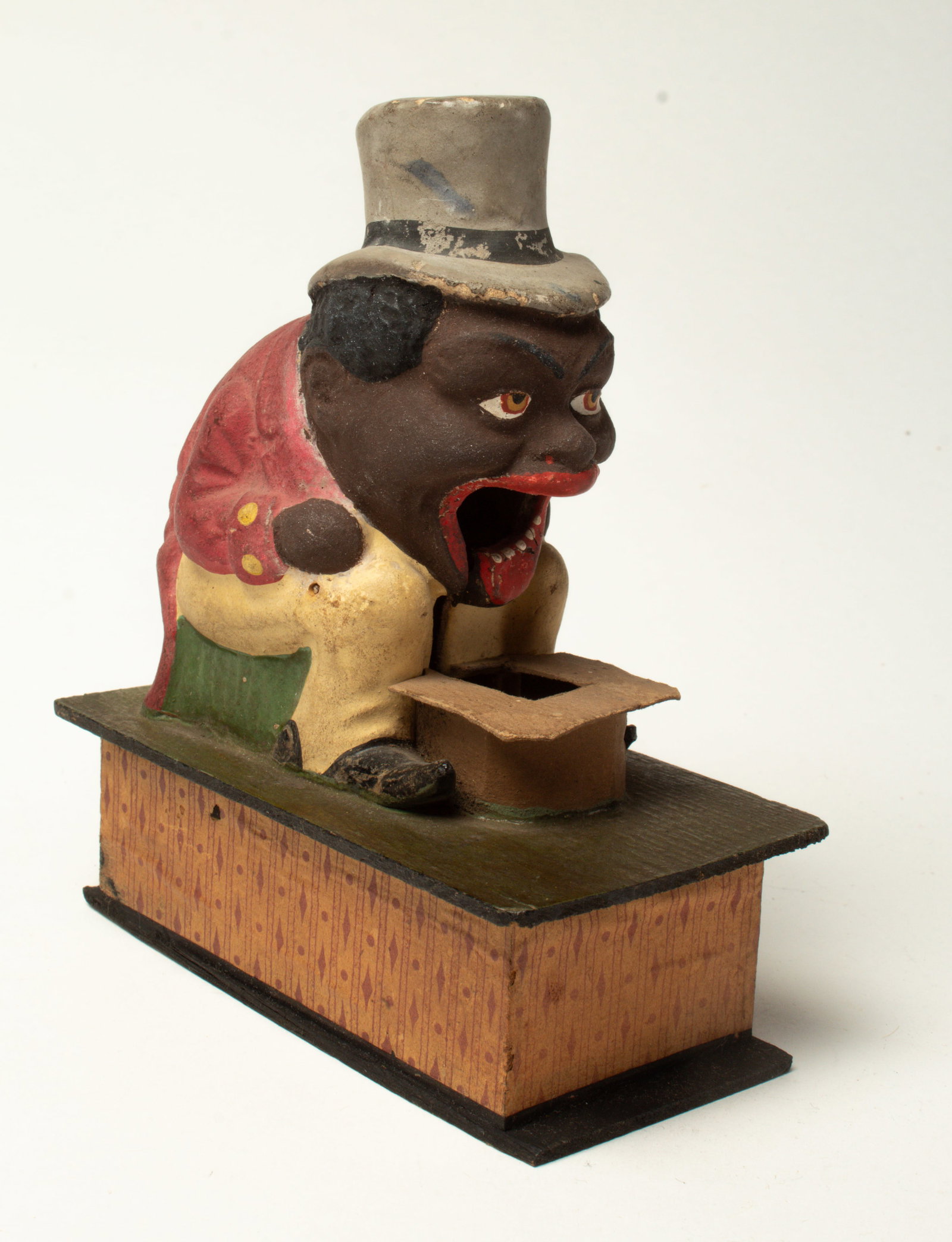 SEATED BLACK MAN "EATER" TOY. (1 of 4)