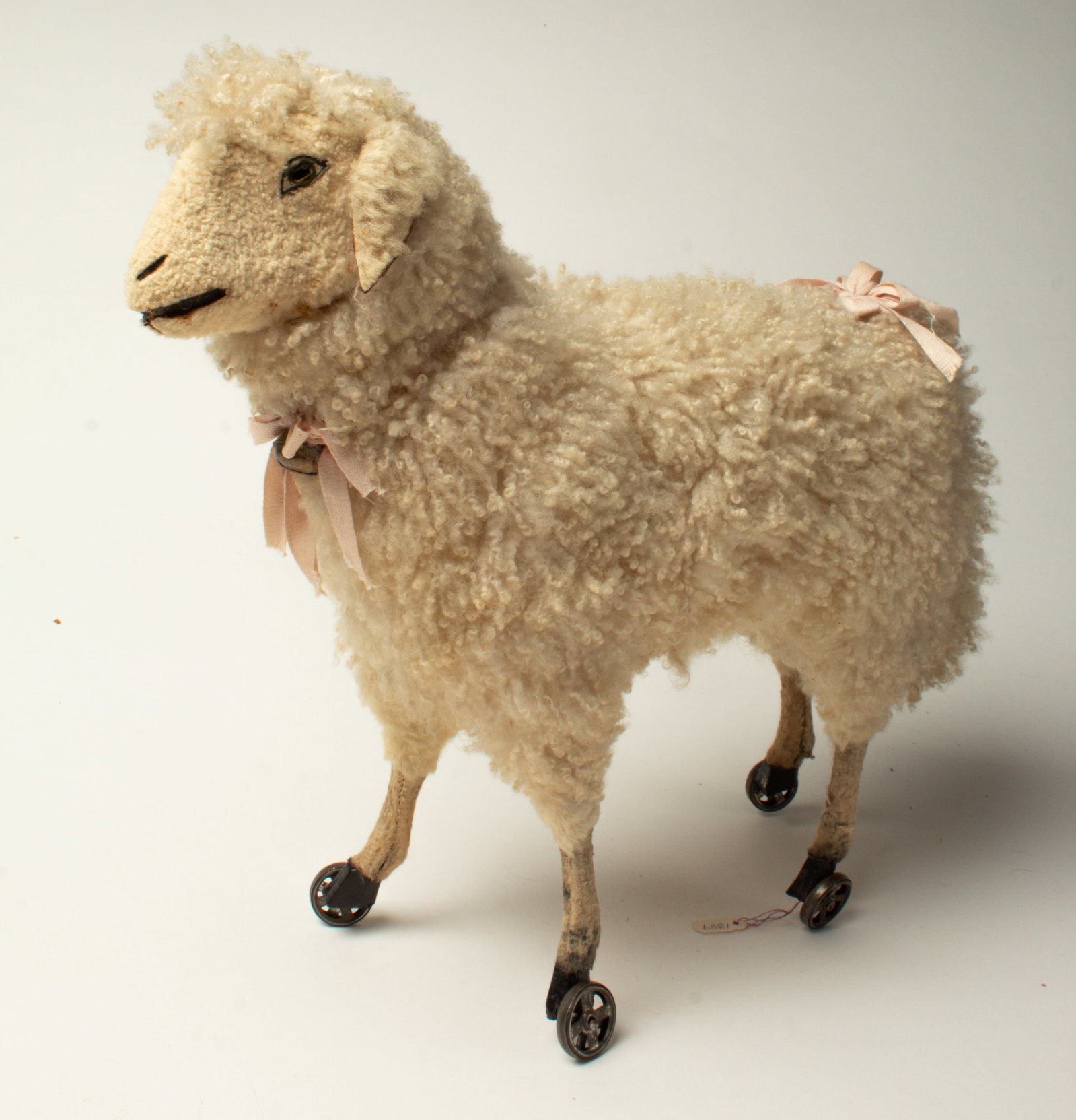 BLEATING LAMB PULL TOY ON SMALL METAL WHEELS. (1 of 4)