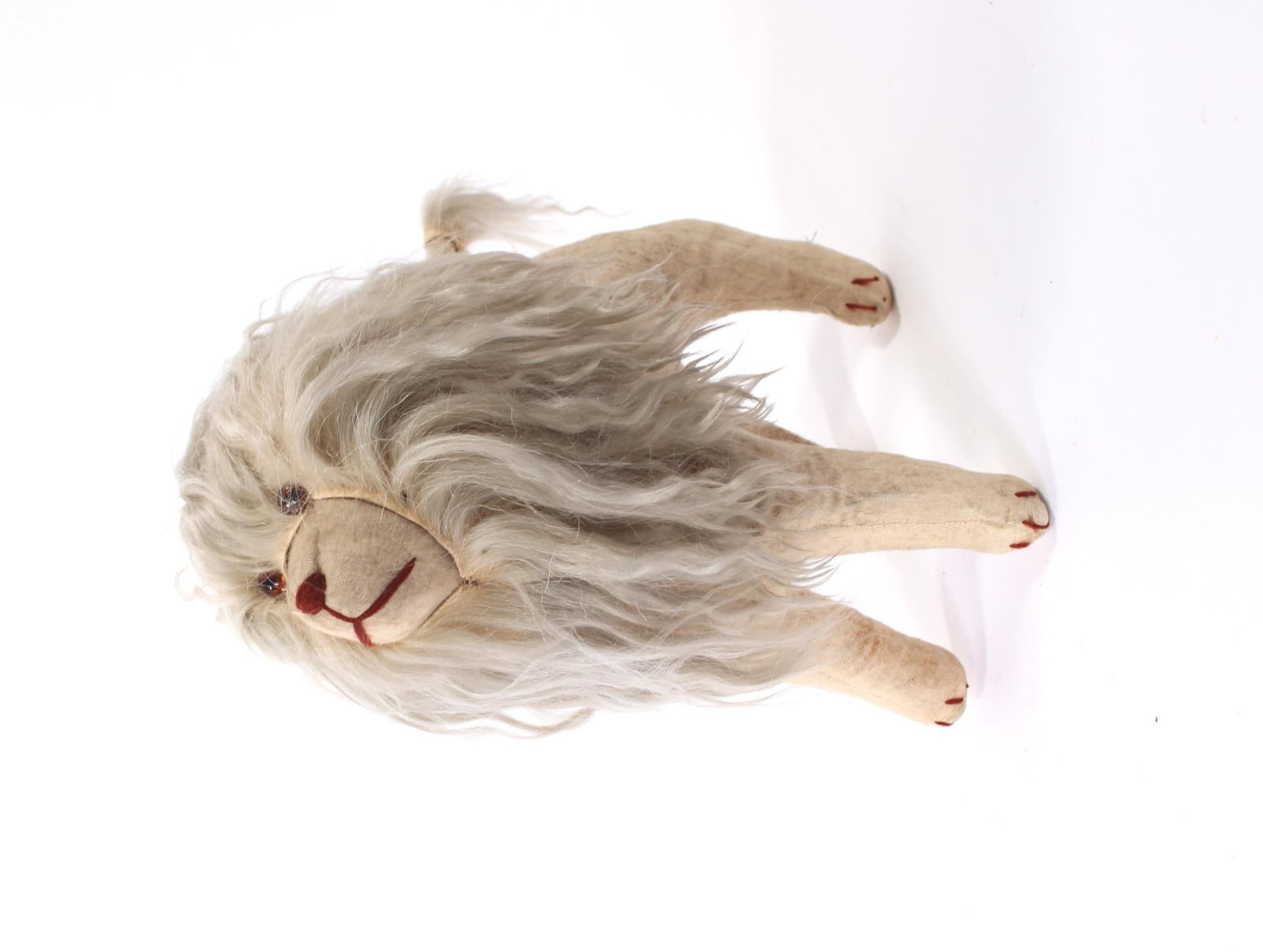 STUFFED DOG TOY WITH LION'S MANE.: STUFFED DOG TOY WITH LION'S MANE. American, early 20th Century. Made for Sears at the turn of the century, cloth-covered, straw-filled bodies, glass eyes, long lion mane, hair at tail end, stitched