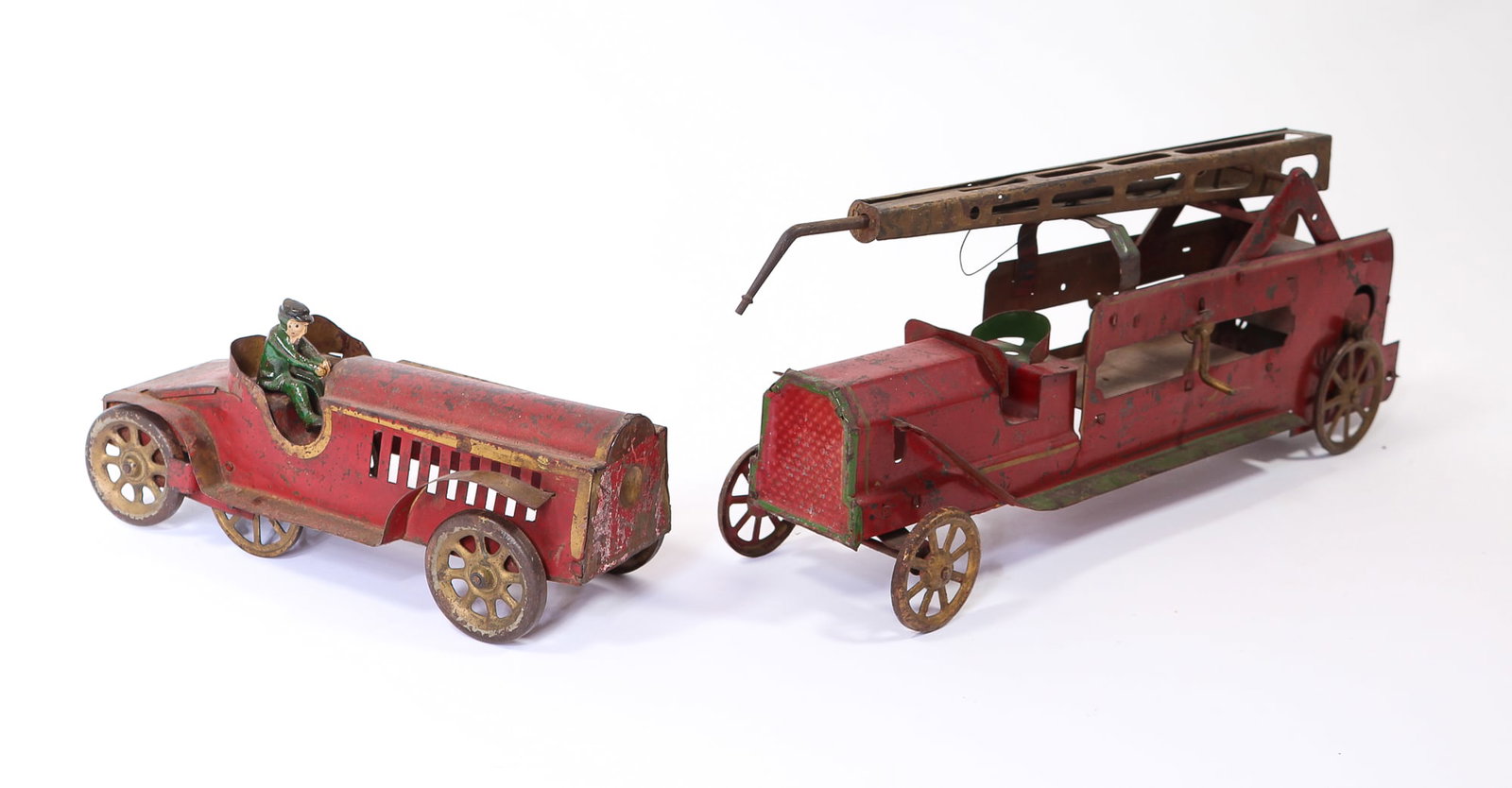 DAYTON (OHIO) HILL CLIMBER PRESSED STEEL FRICTION WATER TOWER FIRE TRUCK AND ROADSTER CAR.: DAYTON (OHIO) HILL CLIMBER PRESSED STEEL FRICTION WATER TOWER FIRE TRUCK AND ROADSTER CAR. American, 20th Century. Red truck with green trim, four gold wheels, gold water tower, and gold flourishes. 7