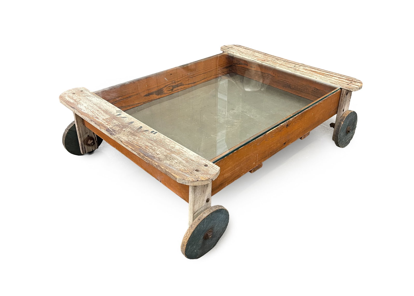 CHILDREN'S SANDBOX ON WHEELS.: CHILDREN'S SANDBOX ON WHEELS. American, 20th Century. Pine. Rectangular sandbox with "KAY" at either end, mounted on four wheels and with a glass top. With the glass top, sandbox is converted into a