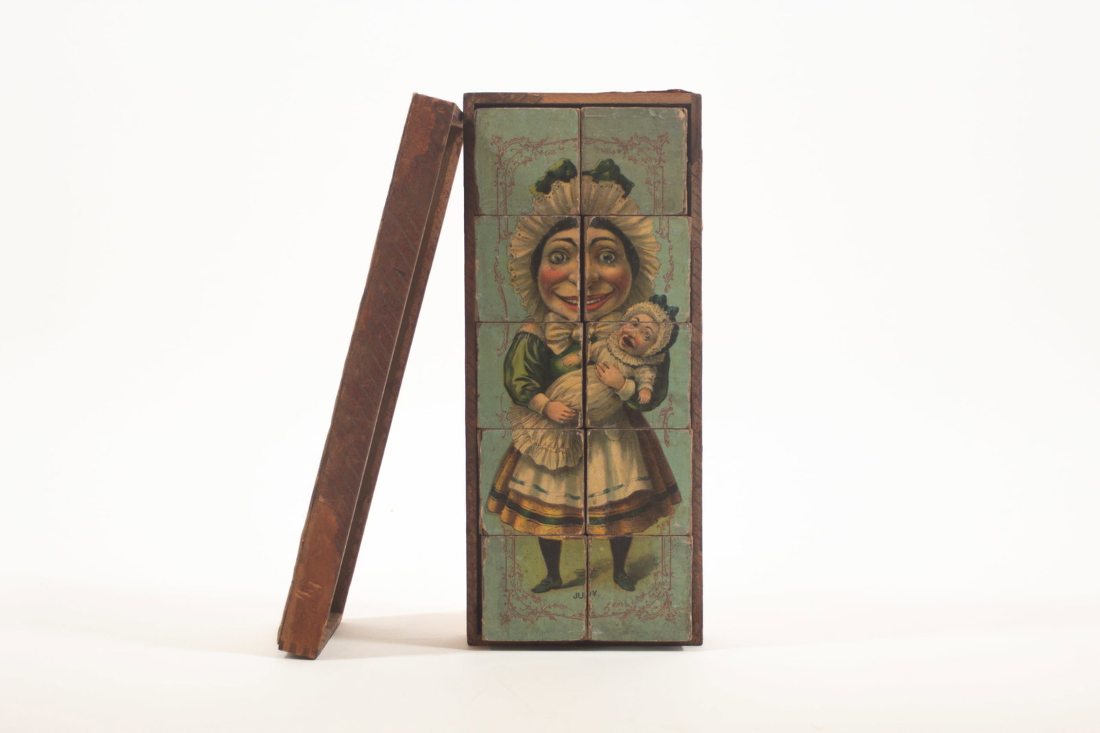 PUNCH AND JUDY PORTRAIT CUBES.: PUNCH AND JUDY PORTRAIT CUBES. American, early 20th Century. By McLoughlin Bros. A set of ten lithographed cubes showing six different characters when put together in original box. 3"h. 5.75"w.