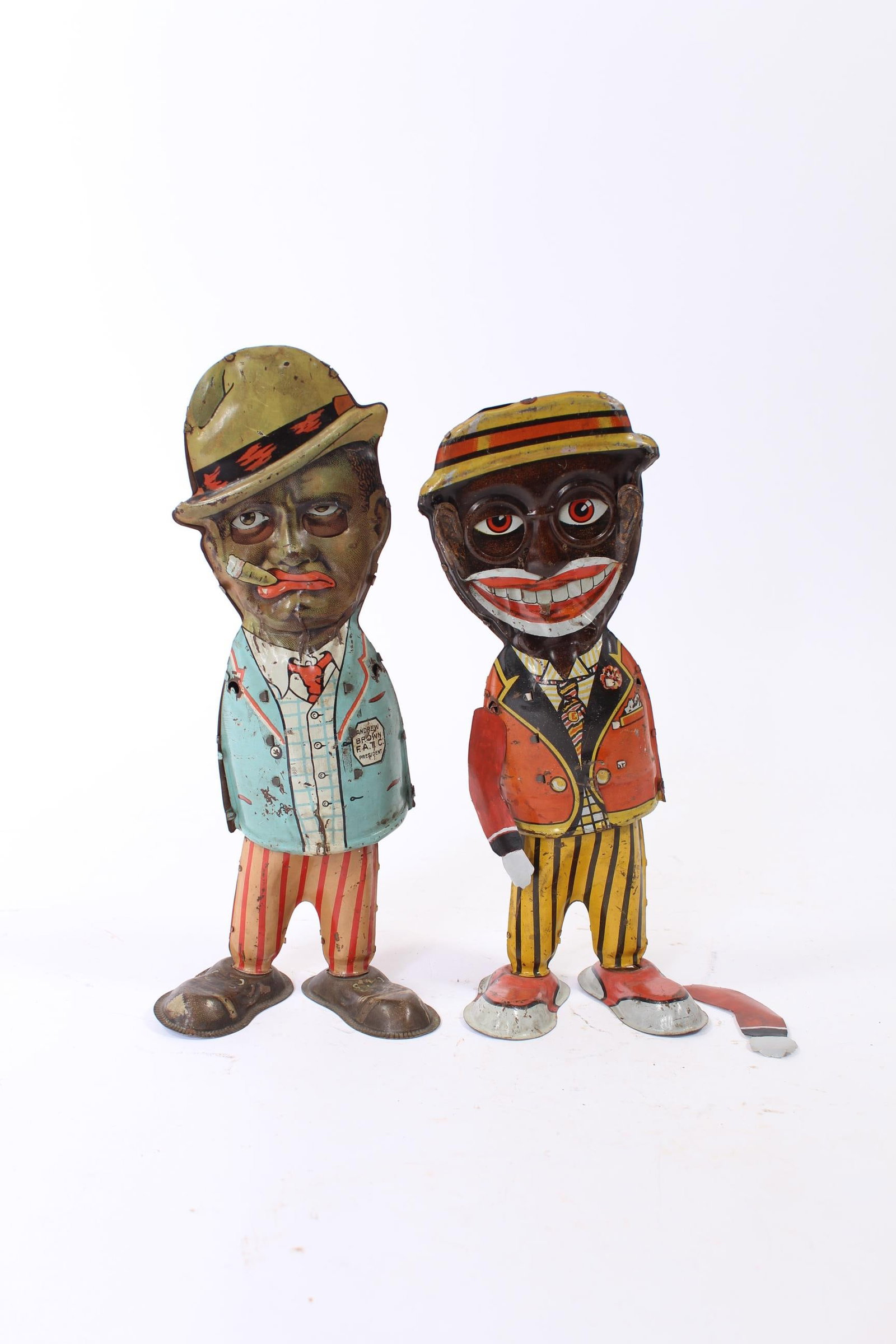 LOUIS MARX (NEW YORK, NEW YORK) TIN LITHO WINDUP MAMMY'S BOY AND ANDY FIGURES.: LOUIS MARX (NEW YORK, NEW YORK) TIN LITHO WINDUP MAMMY'S BOY AND ANDY FIGURES. American, 20th Century. Both are polychrome-printed with moving facial features, articulated hips, and large shoes.