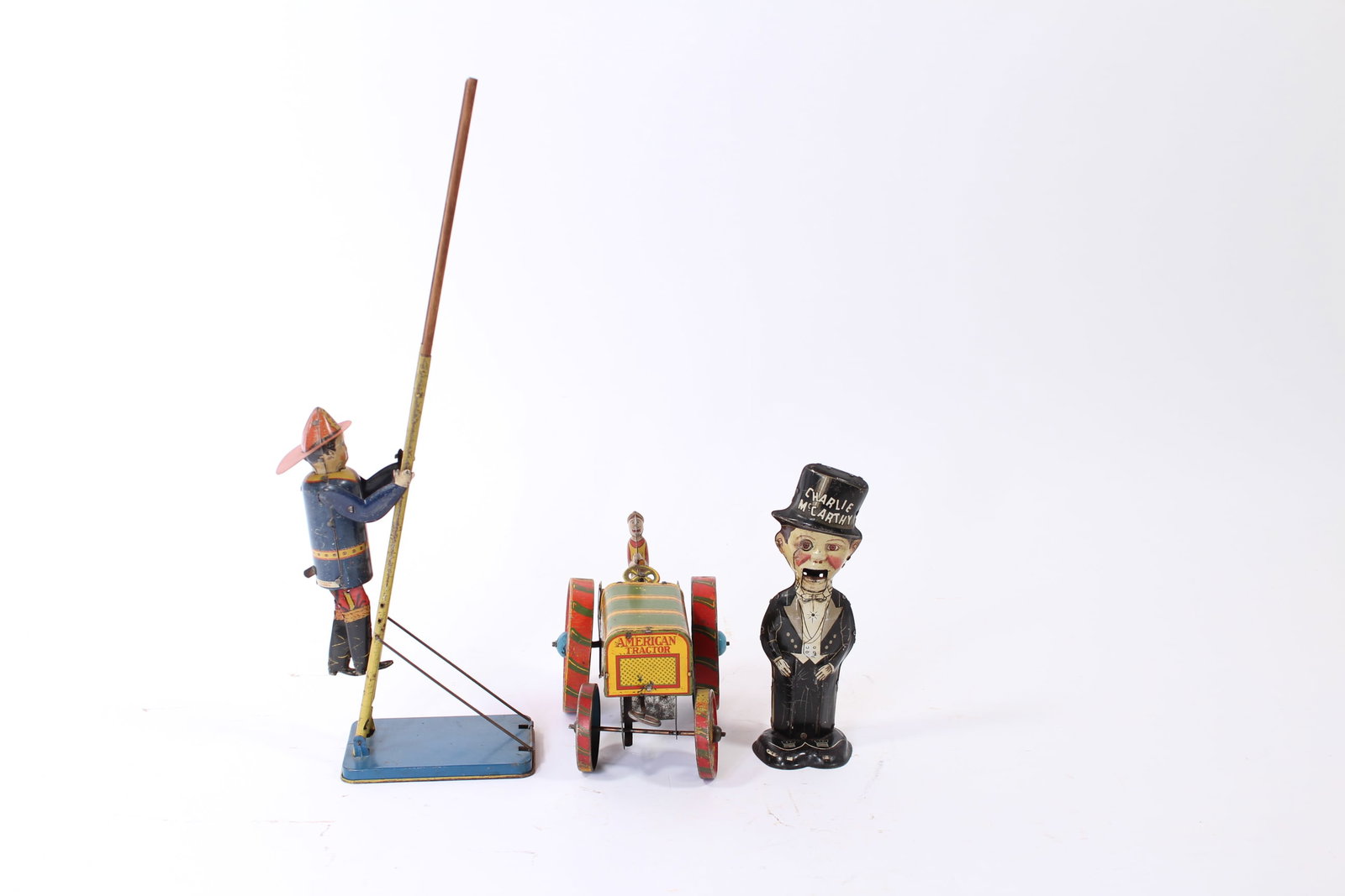 THREE LOUIS MARX (NEW YORK, NEW YORK) TIN LITHO WINDUP TOYS, COMPRISING CHARLIE MCCARTHY, CLIMBING (1 of 13)