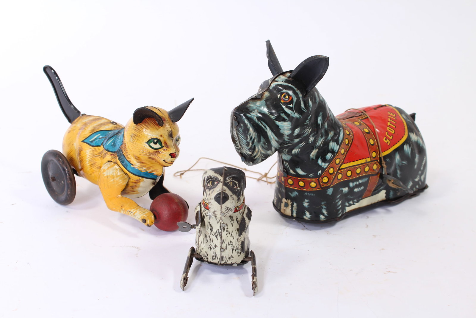 TWO LOUIS MARX (NEW YORK, NEW YORK) TIN LITHO WINDUP DOGS AND A PUMP-TAIL CAT. (1 of 17)