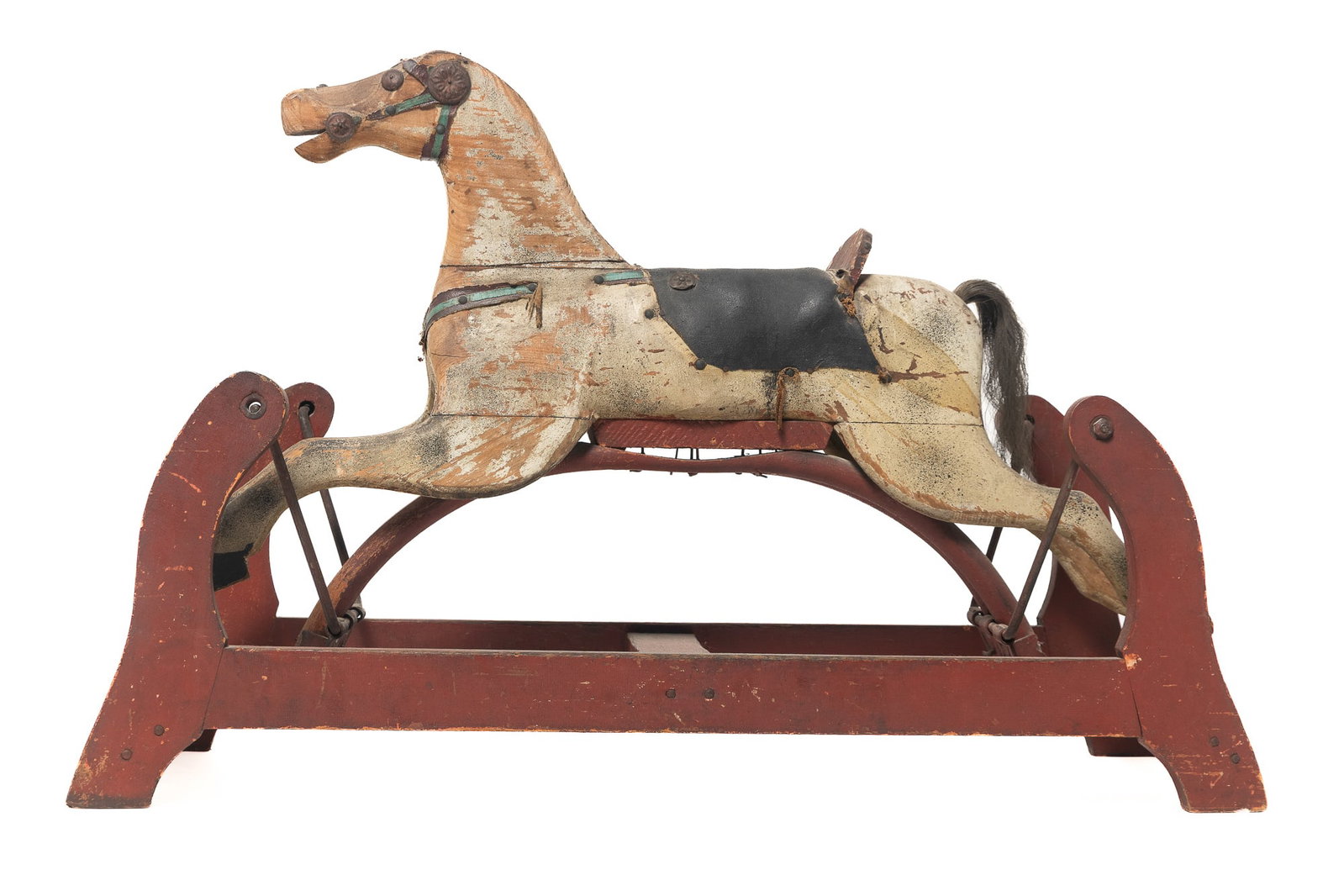 CARVED AND PAINTED WOOD ROCKING HORSE ON GLIDER BASE.: CARVED AND PAINTED WOOD ROCKING HORSE ON GLIDER BASE. American, early 20th Century. Multi-section horse with gray paint, horsehair tail, metal eyes, painted reins, and a leather saddle seat. Base with