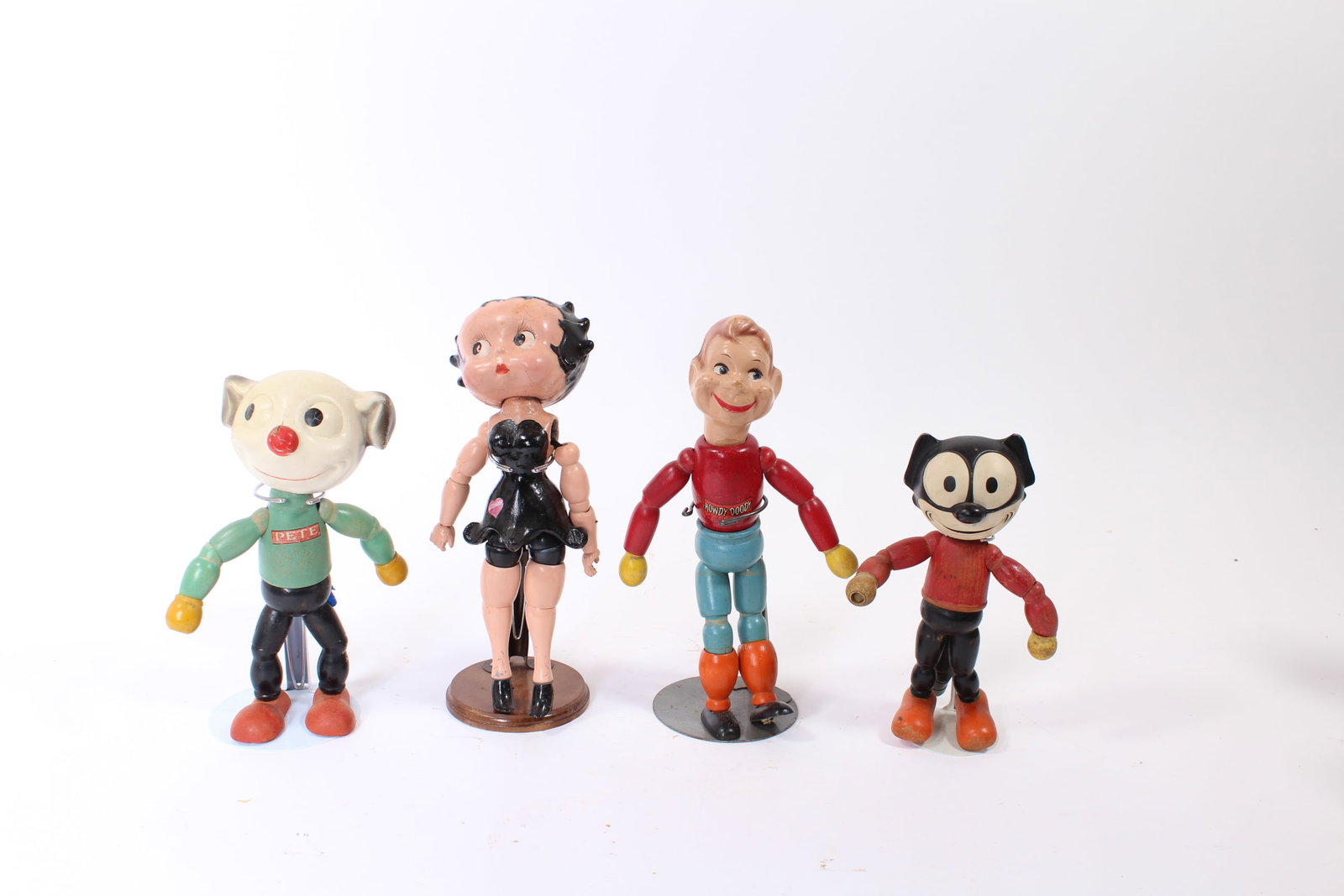 CAMEO DOLL COMPANY (NEW YORK/PENNSYLVANIA) FELIX THE CAT, PETE THE PUP, BETTY BOOP, AND HOWDY DOODY: CAMEO DOLL COMPANY (NEW YORK/PENNSYLVANIA) FELIX THE CAT, PETE THE PUP, BETTY BOOP, AND HOWDY DOODY PAINTED COMPOSITION AND WOOD ARTICULATED DOLLS. American, 20th Century. Felix with a worn-off label,