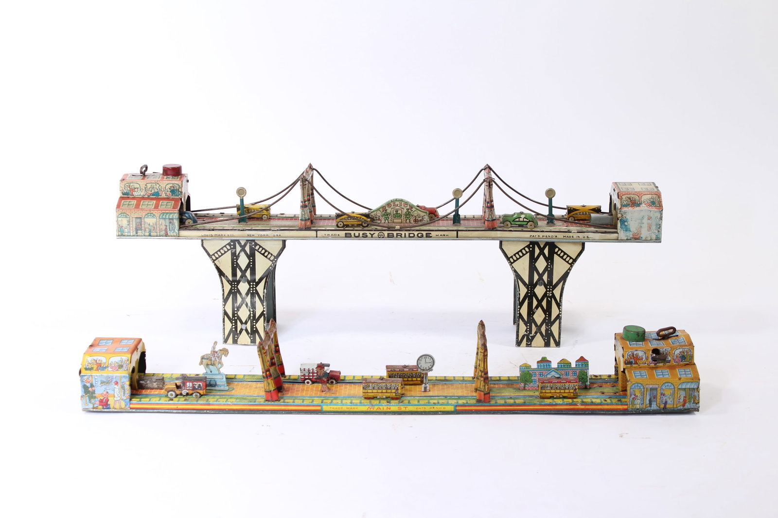 LOUIS MARX (NEW YORK, NEW YORK) TIN LITHO WINDUP BUSY BRIDGE AND MAIN STREET. (1 of 17)