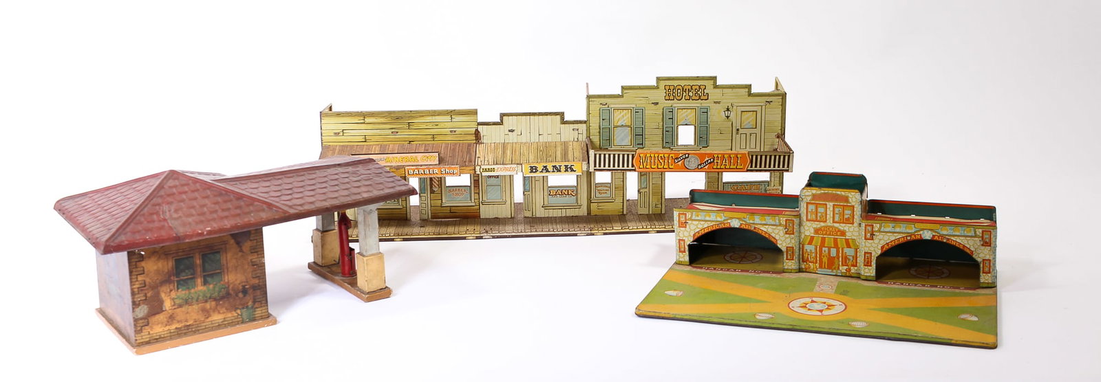 LOUIS MARX (NEW YORK, NEW YORK) ROY ROGERS' MINERAL CITY, GIBBS TOYS (CANTON, OHIO) GAS STATION, AND: LOUIS MARX (NEW YORK, NEW YORK) ROY ROGERS' MINERAL CITY, GIBBS TOYS (CANTON, OHIO) GAS STATION, AND CITY AIRPORT PLAYSETS. American, 20th Century. Gas station with wood and tin parts, unmarked; tin