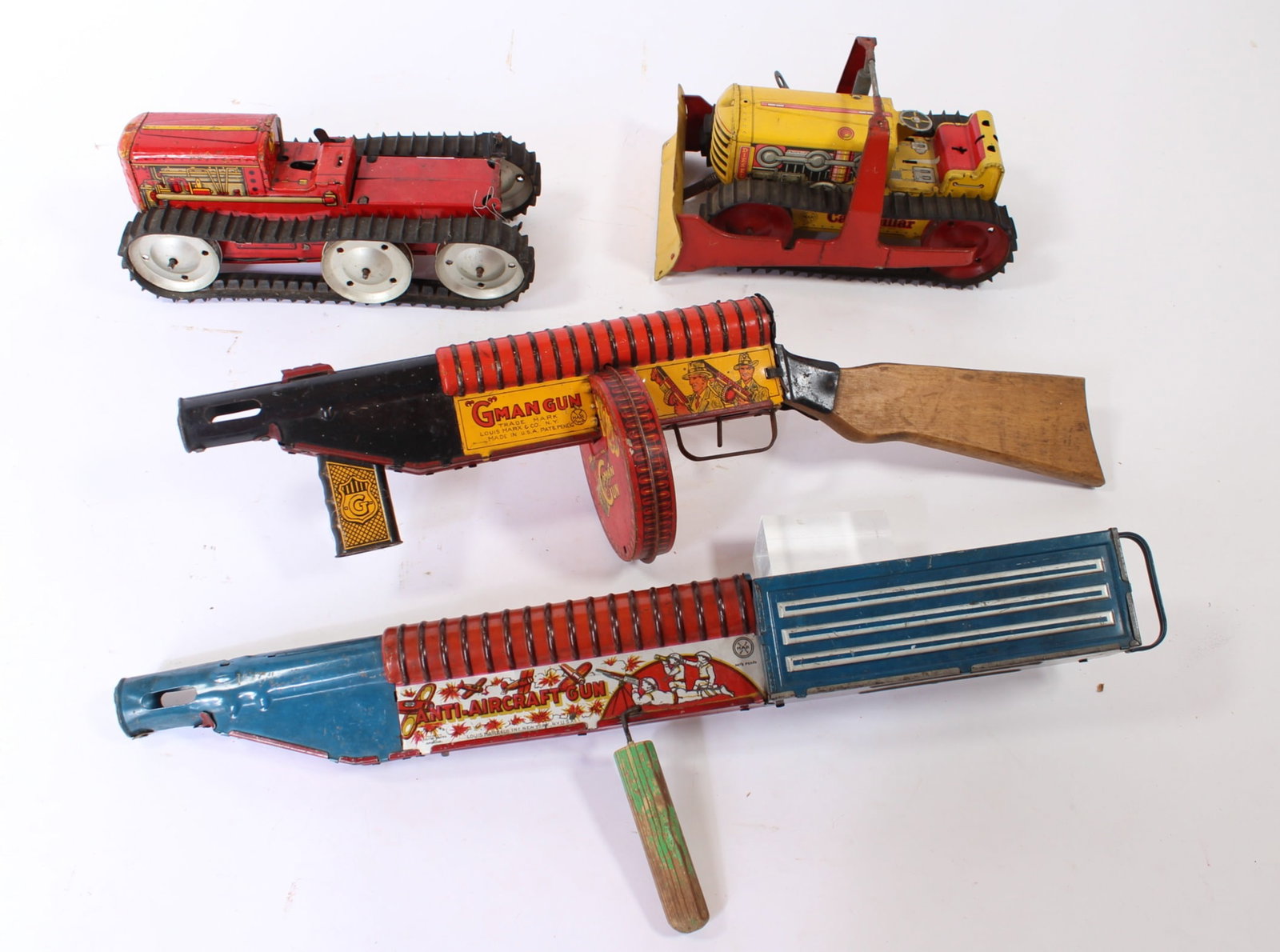 LOUIS MARX (NEW YORK, NEW YORK) TIN LITHO WINDUP GMAN GUN, ANTI-AIRCRAFT GUN, CATERPILLAR DOZER, AND (1 of 16)